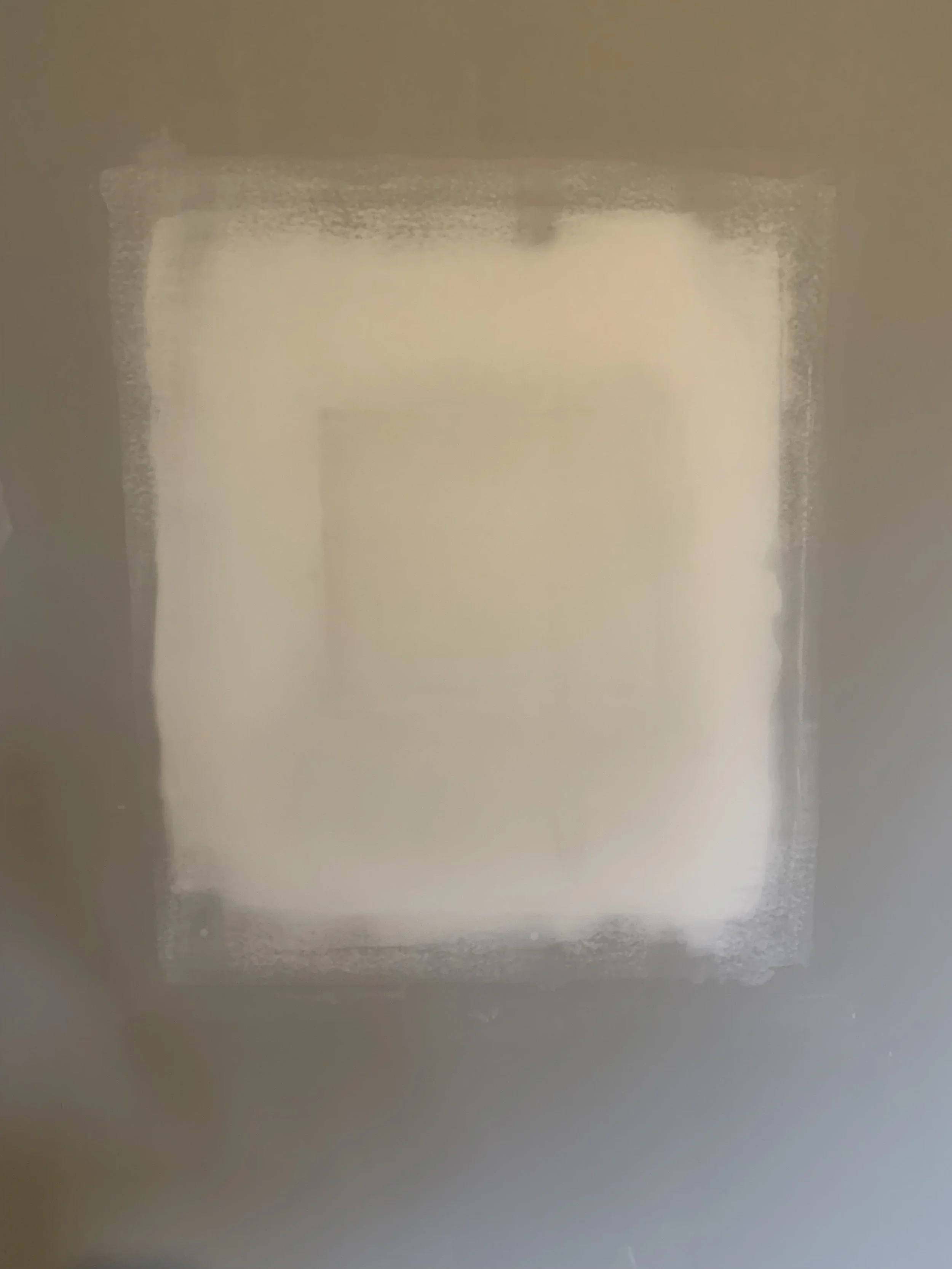 Patch of drywall wall in a home that has been repaired.