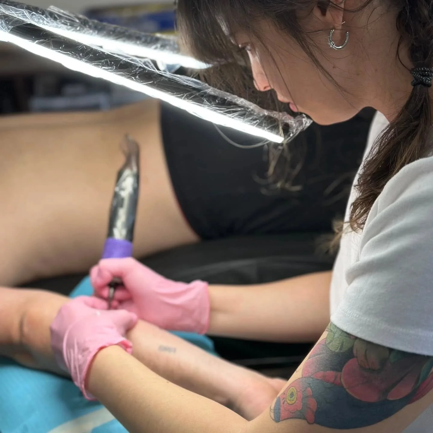 Meet Anastasia! Ana joined our team In February, and has been creating stunning body art for the past 1.5 years.  She specializes in fine line work, whip shading, and micro realism. Her journey into tattooing began with a deeply personal experience, 