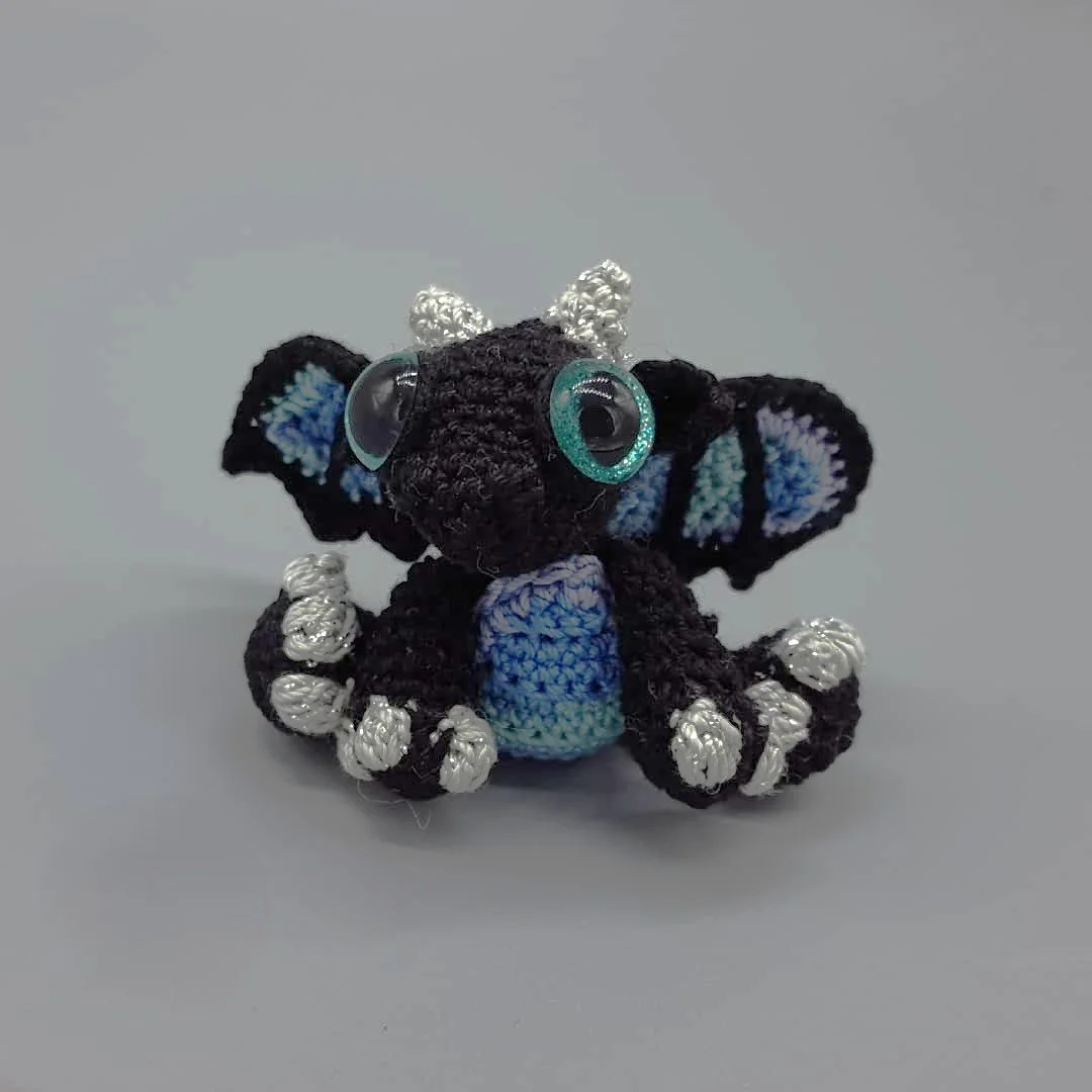 Black and silver crochet baby dragon