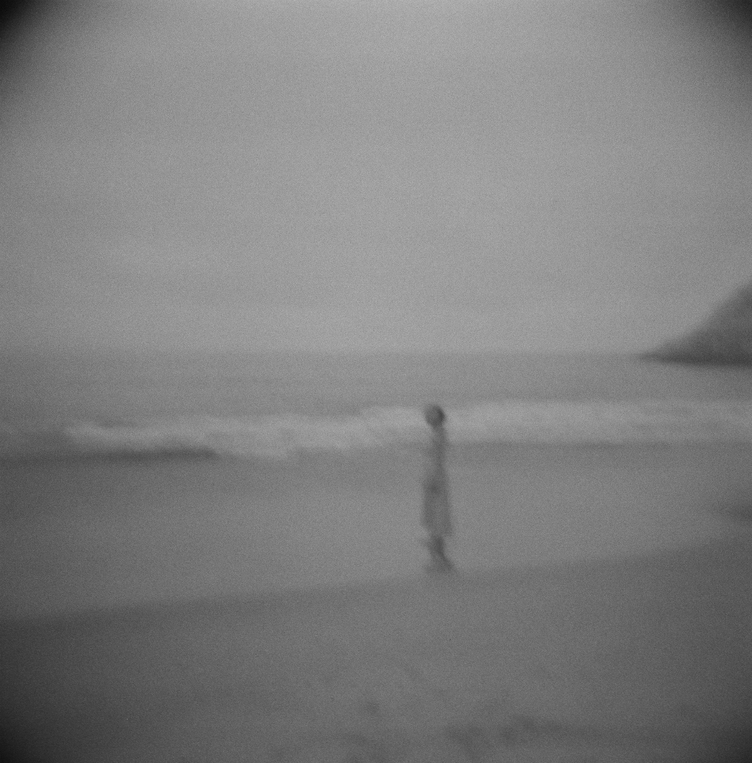 blurry film photo portrait of a women on the beach