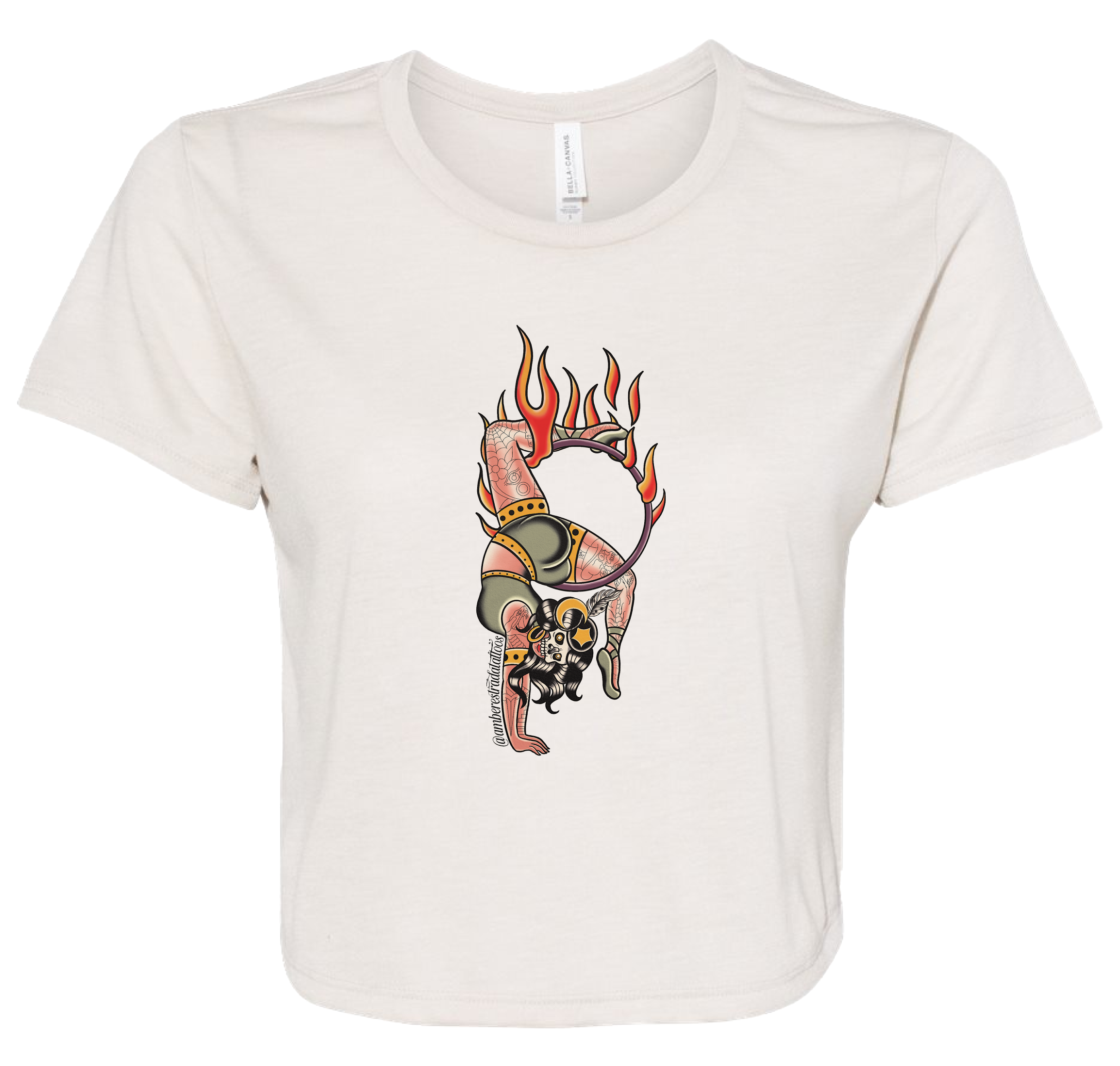 A white T-shirt with a tattoo-style illustration of a devilish figure with flames, skull face, and devil horns, holding a whip.