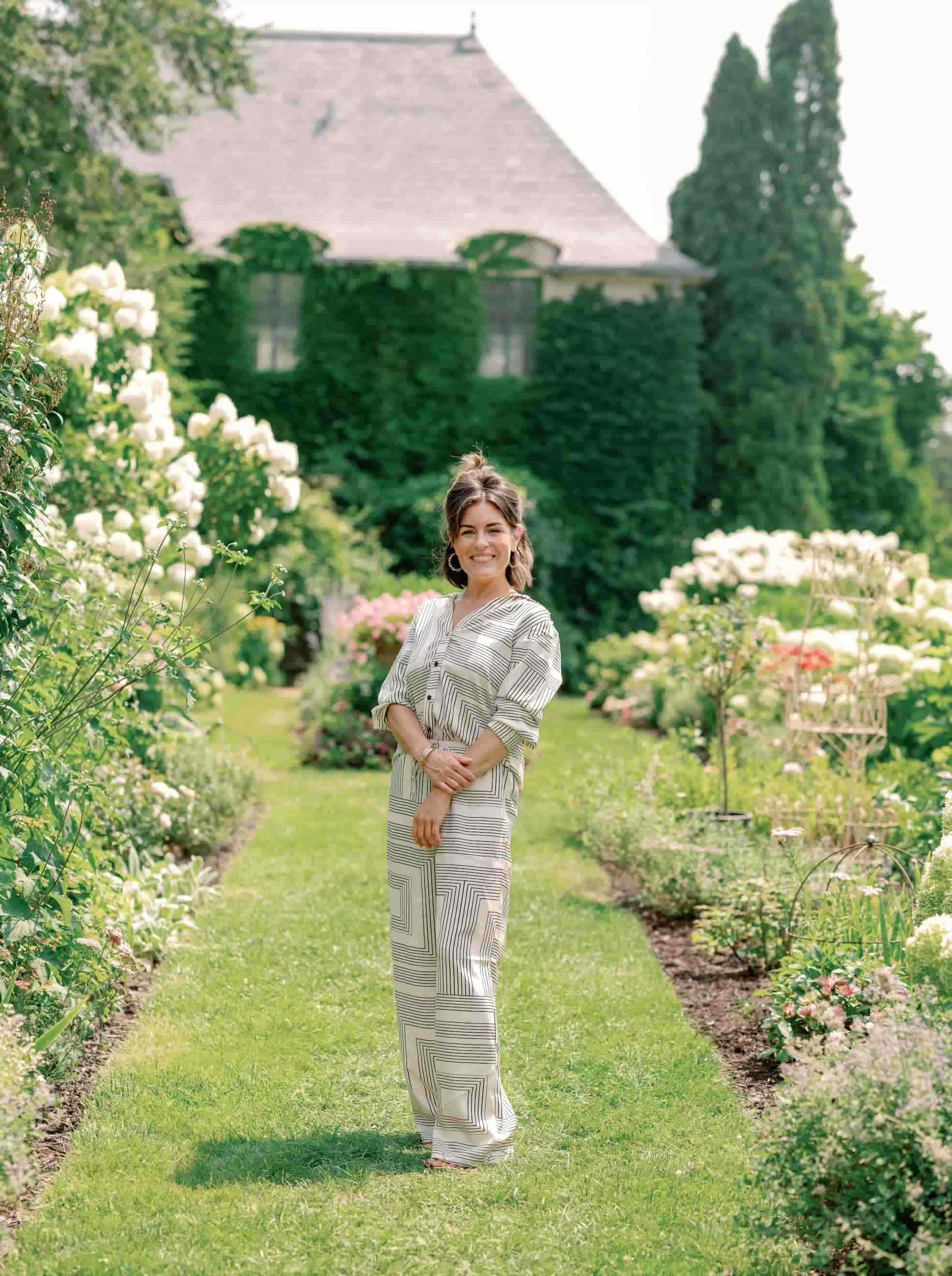 Danielle of Futtitinni Events standing in the Gardens at Greencrest Manor in Battle Creek Michigan