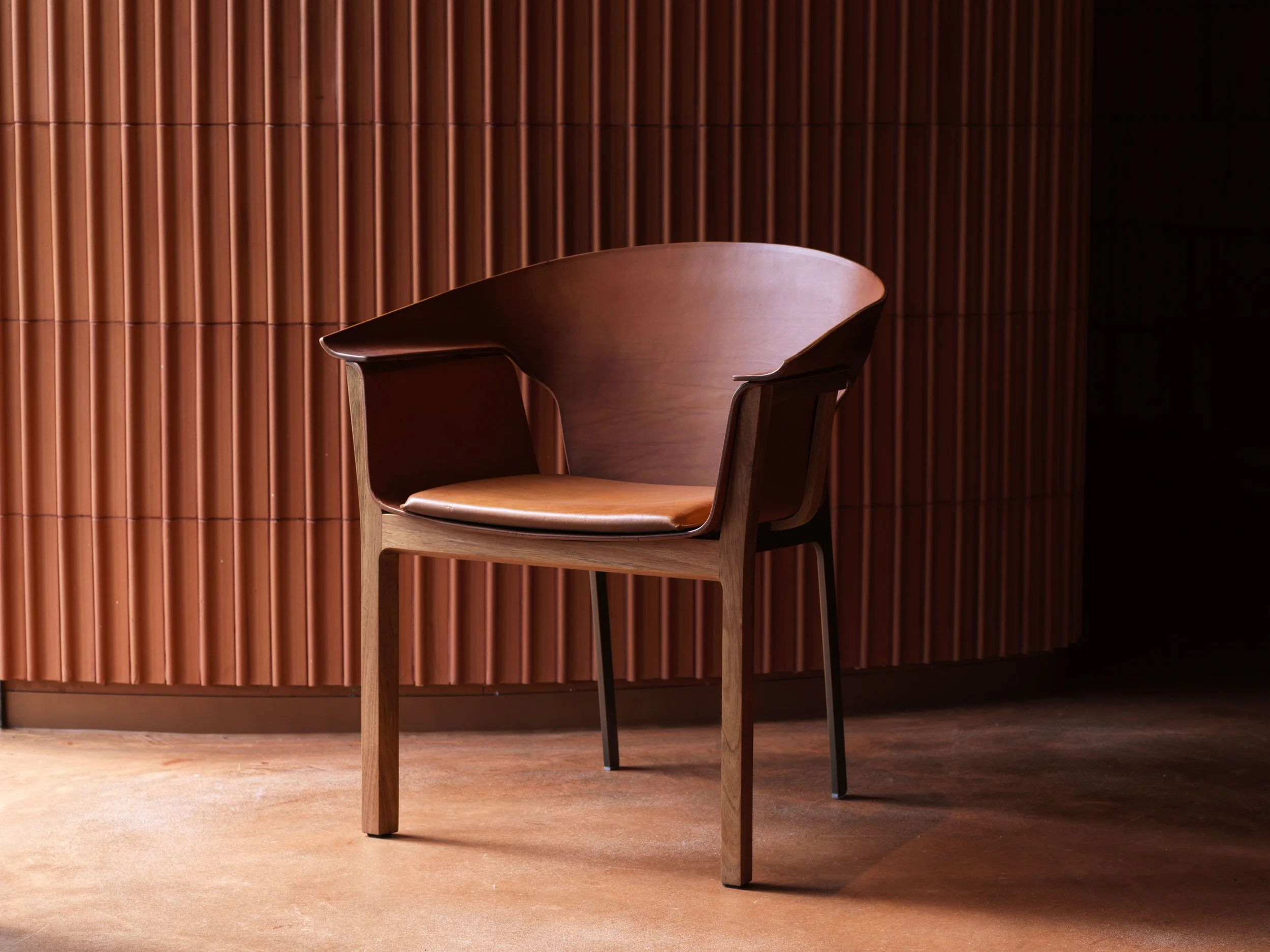 Jon Goulder Pavilion Chair. Pressed Leather seat and back on Blackwood and aluminium frame. Image Jason Loucas .jpg