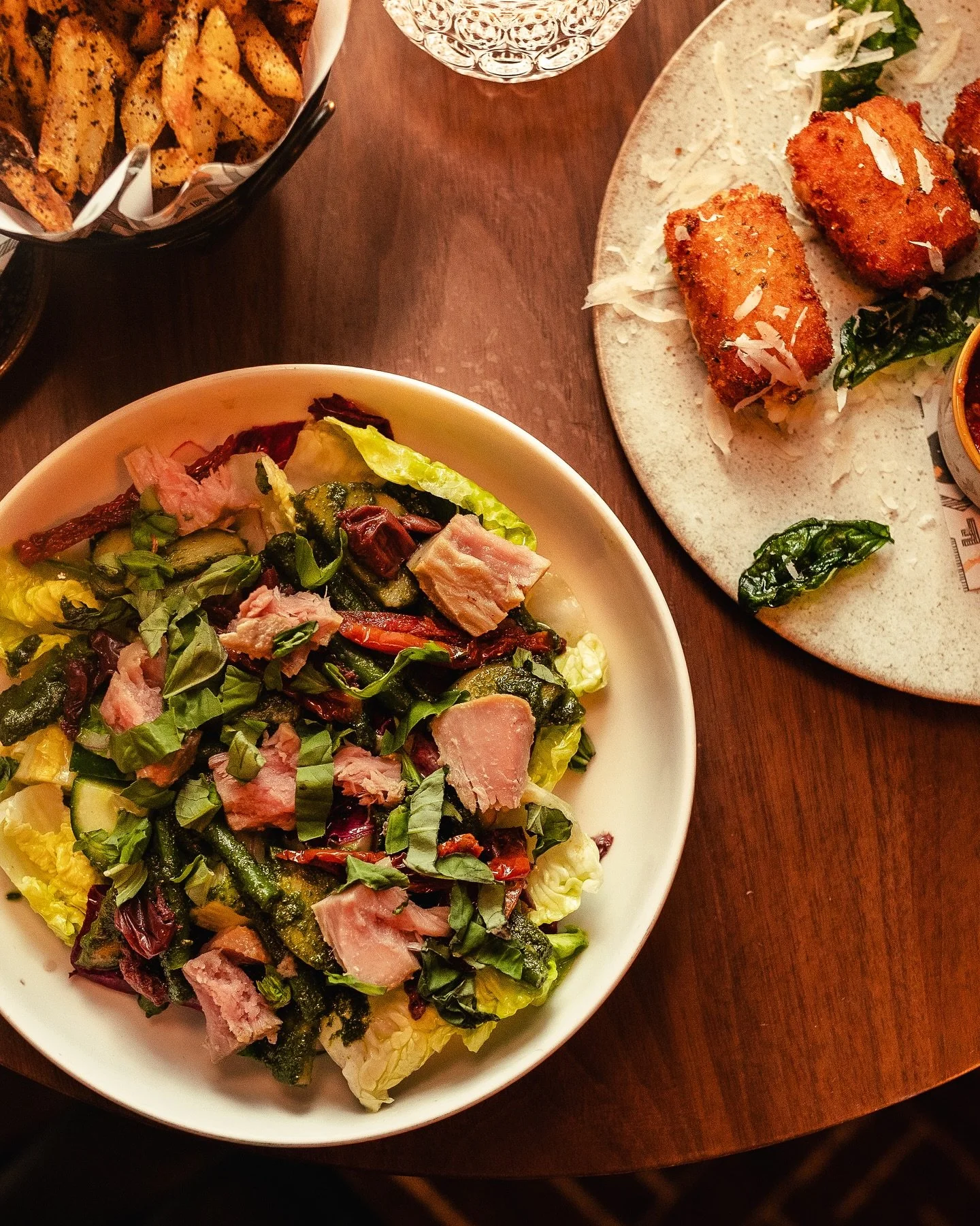 Chutoro Conversation Insalata

We slow cook the chutoro, cure it with salt, garlic and basil, then poach it in extra virgin olive oil and keep it in its own oil. 
It&rsquo;s inspired by the Ligurian coast &mdash; a mix of potatoes, green beans, olive