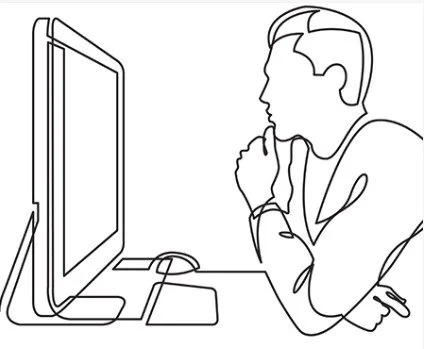 Person sitting at a desk using a computer with a monitor, mouse, and keyboard.
