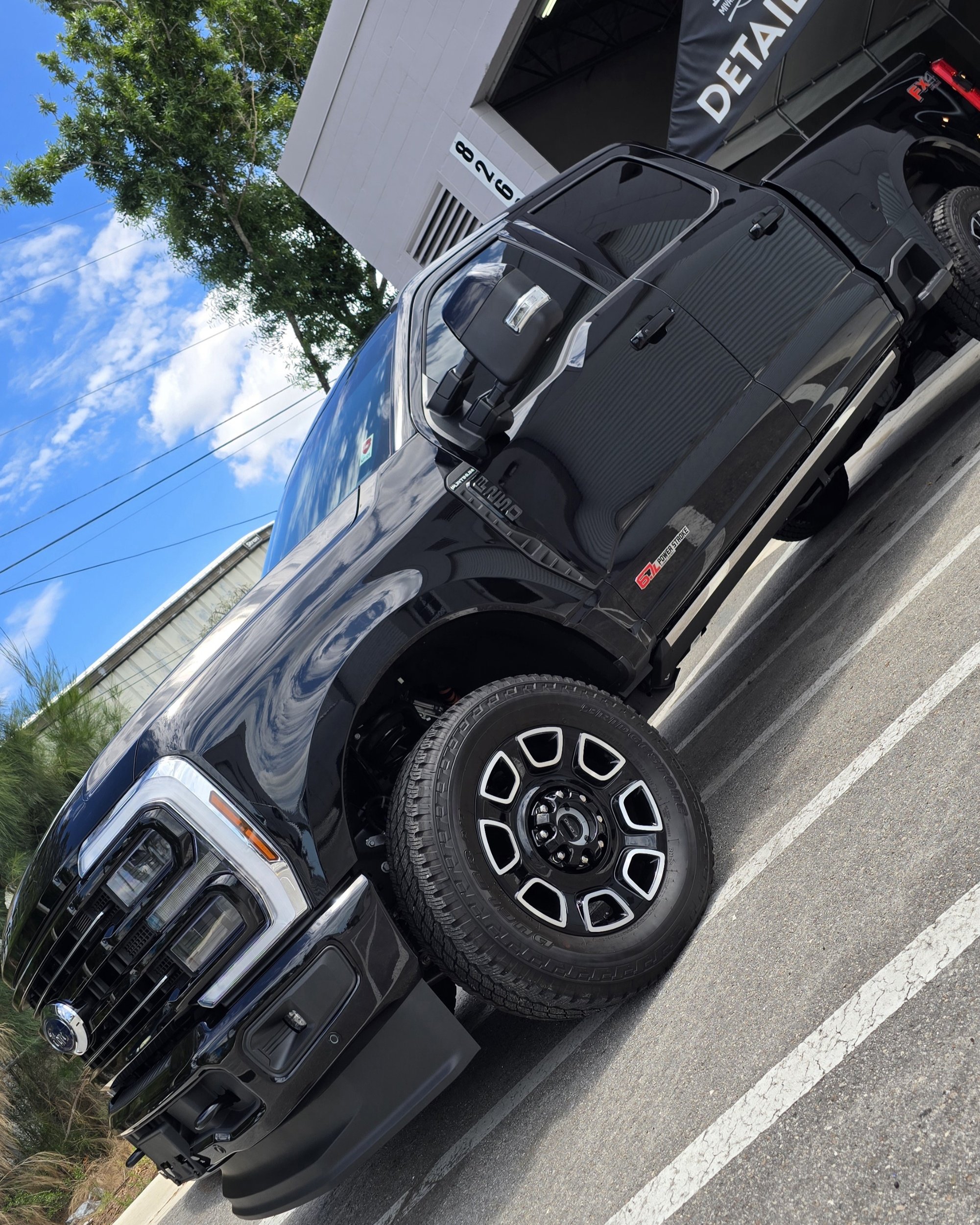 Black Ford F-250 Super Duty after self-healing ceramic coating for durable shine and paint defense in Largo Florida