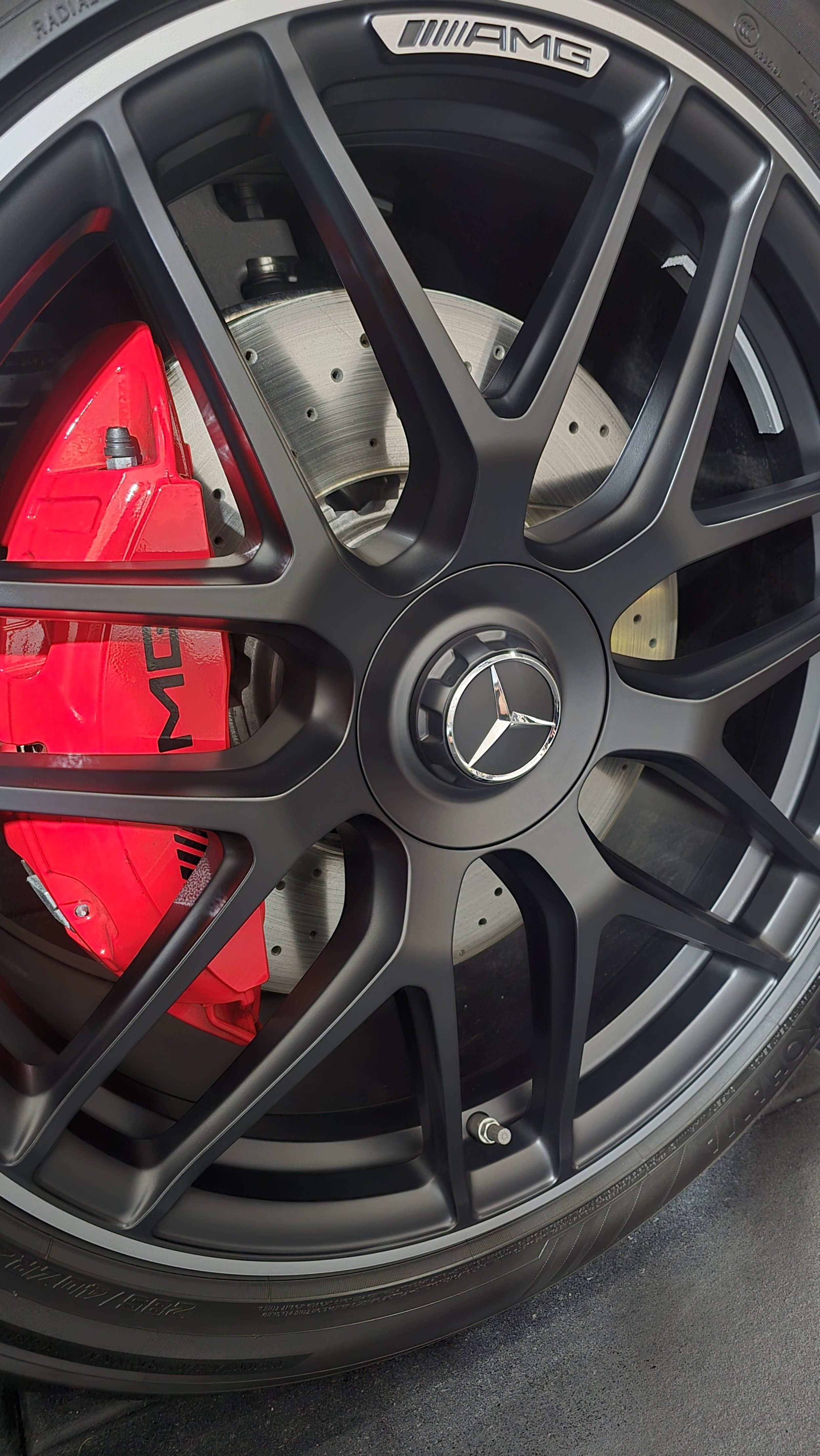 Clean ceramic coated matte black wheel on a Mercedes GLE63