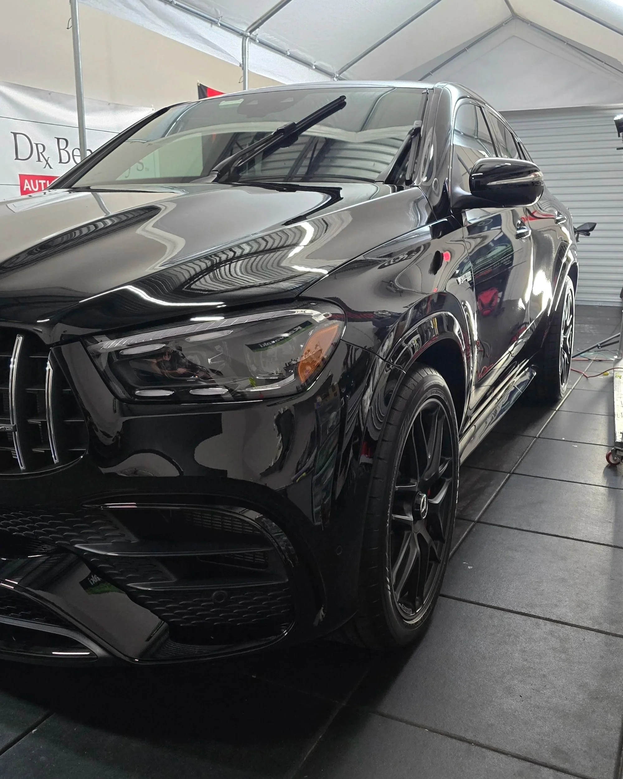 Black Mercedes AMG SUV with self-healing ceramic coating and deep gloss finish in Largo FL