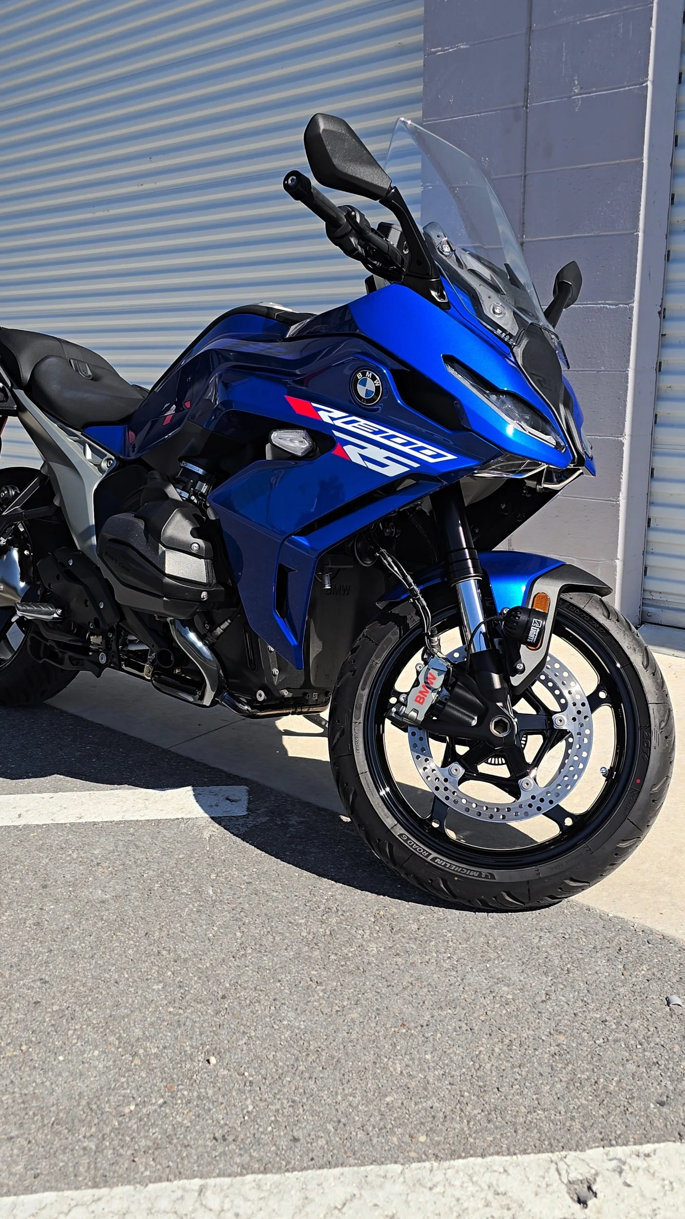 Blue BMW R1300RS motorcycle finished with 7-year ceramic coating outside ceramic coating shop in Largo, FL