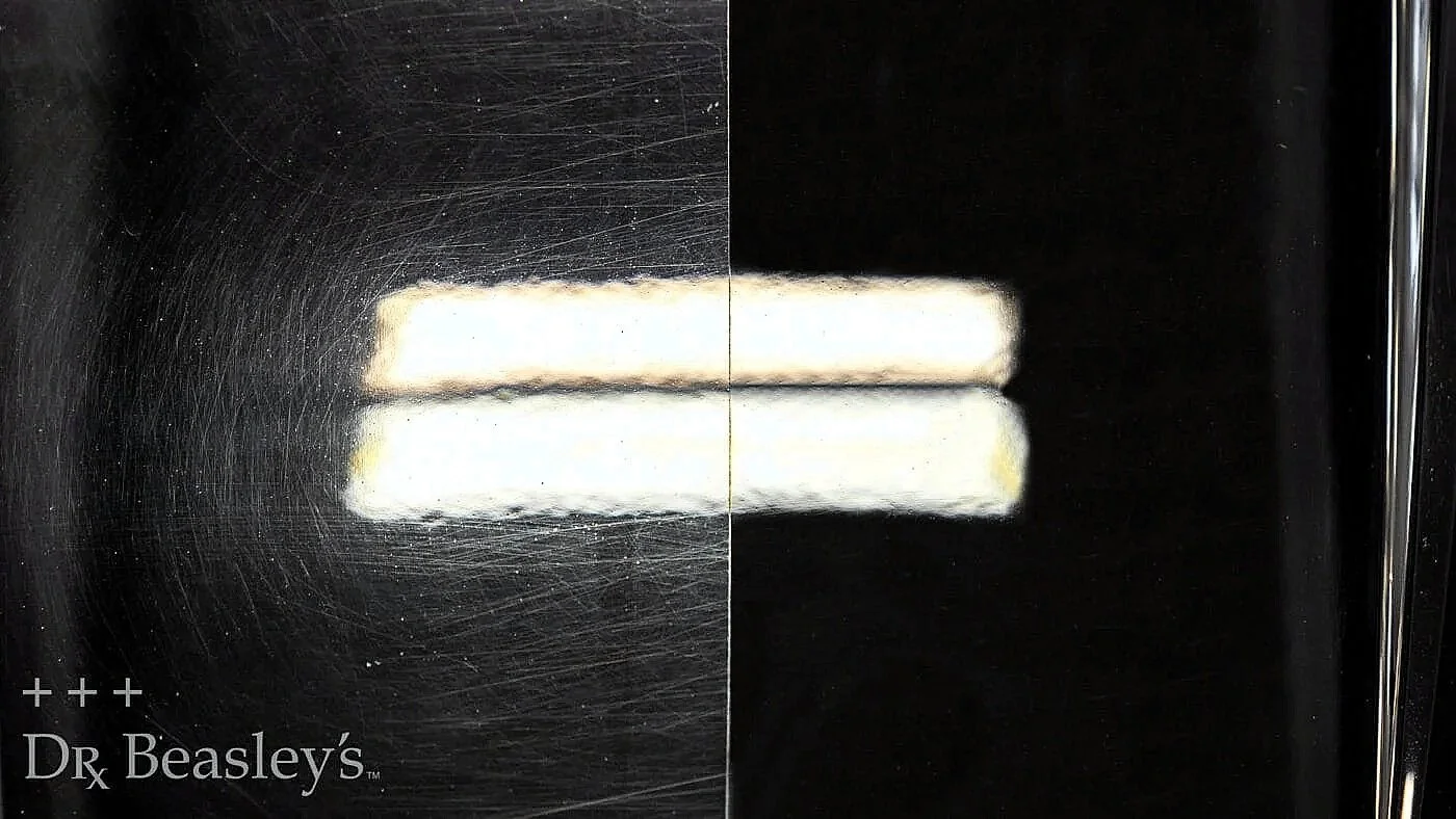 before and after photo of paint correction of swirls on black paint. self-healing coating would prevent this damage.