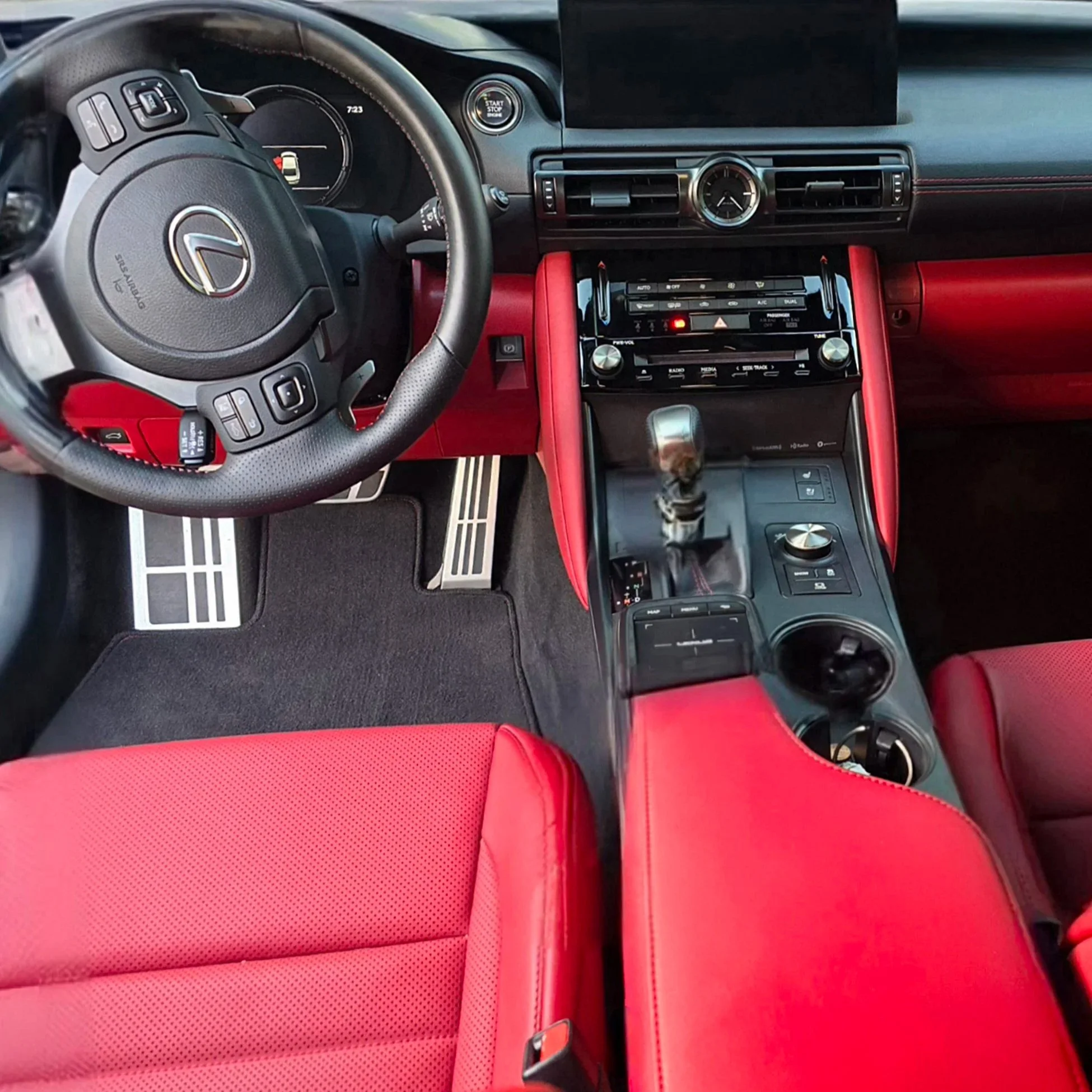 Red leather interior detailed on a silver Lexus IS350