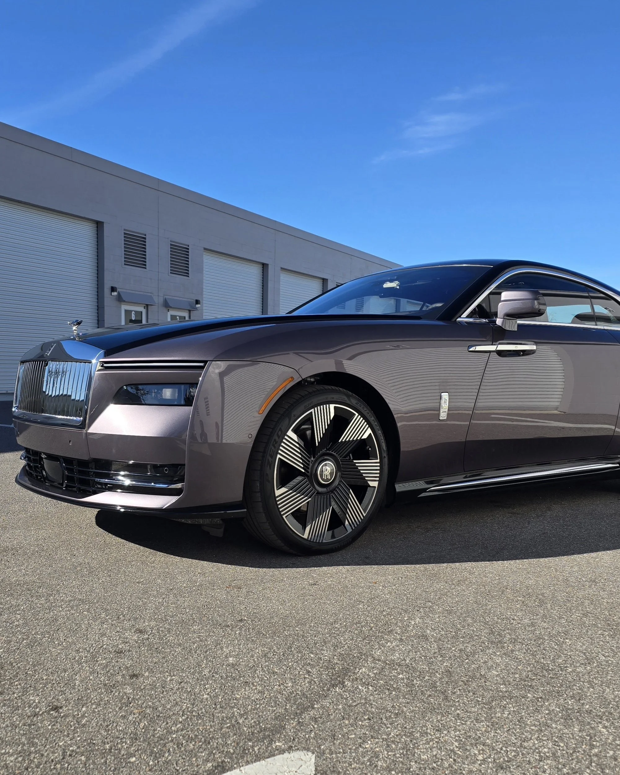 Luxury Rolls-Royce Spectre electric coupe after an exclusive self-healing ceramic coating and flawless paint correction.