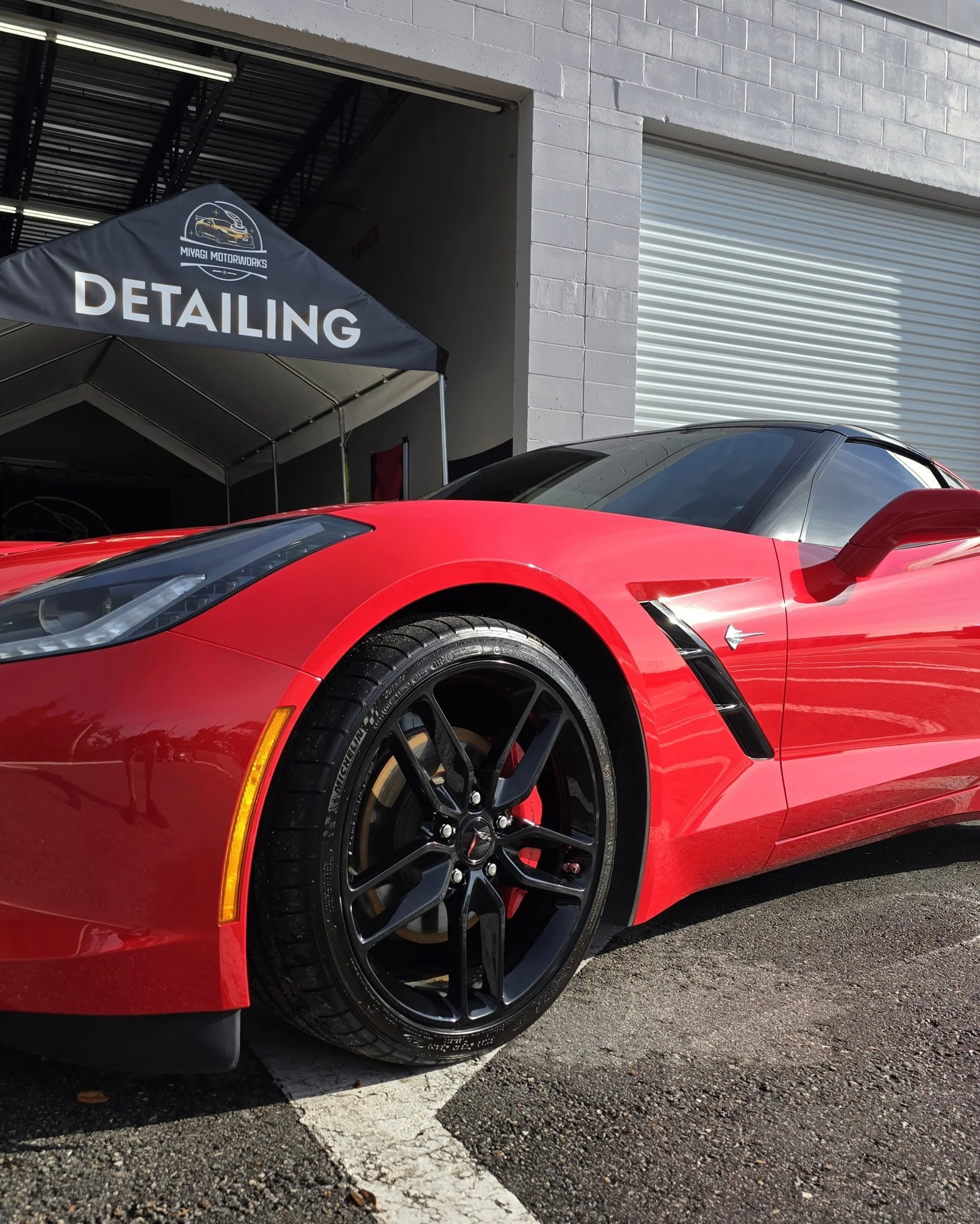 red corvette outside shop  after a 7 year ceramic coating