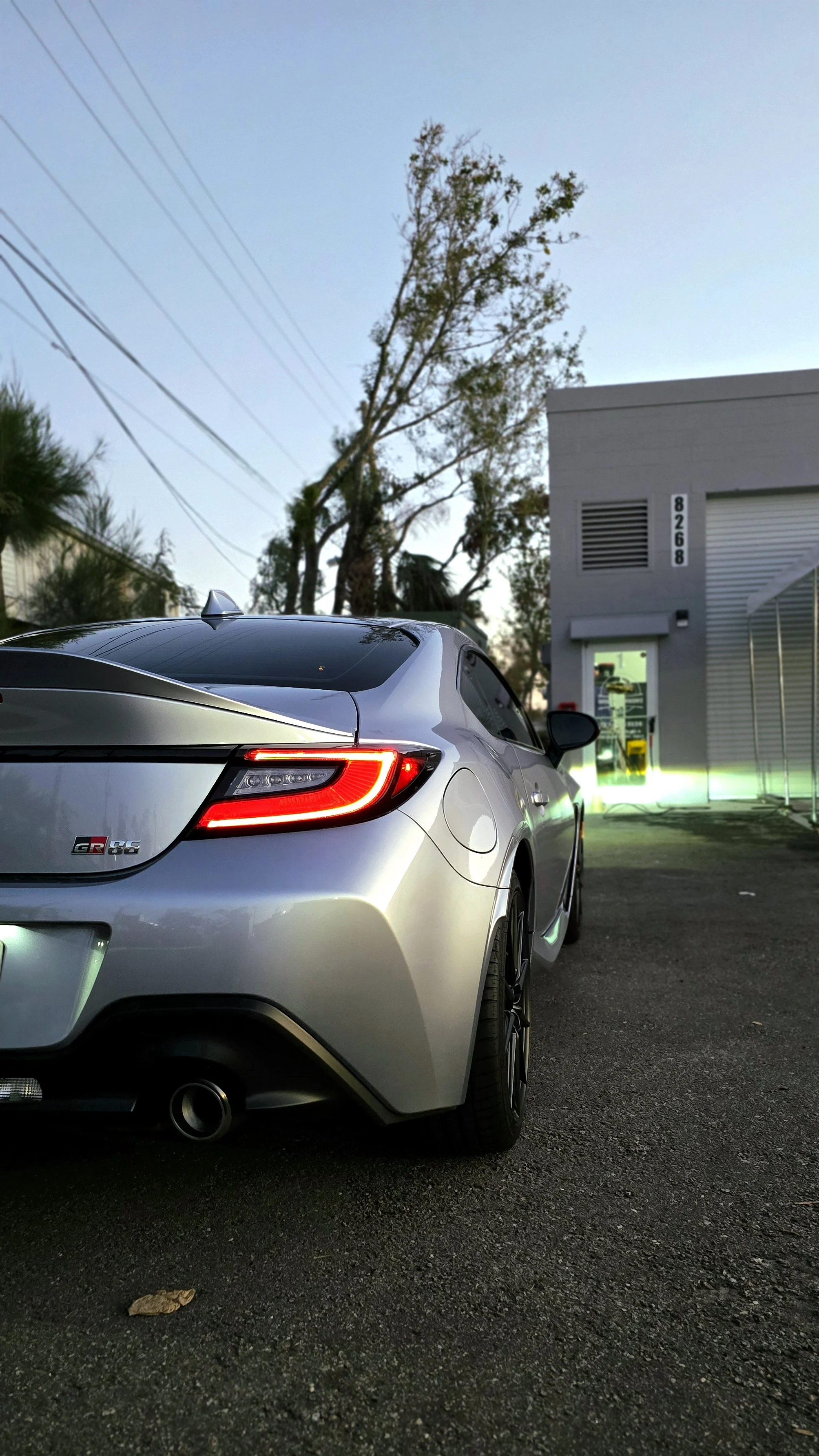 Silver Toyota GR86 in front of the Miyagi Motorworks shop in Largo