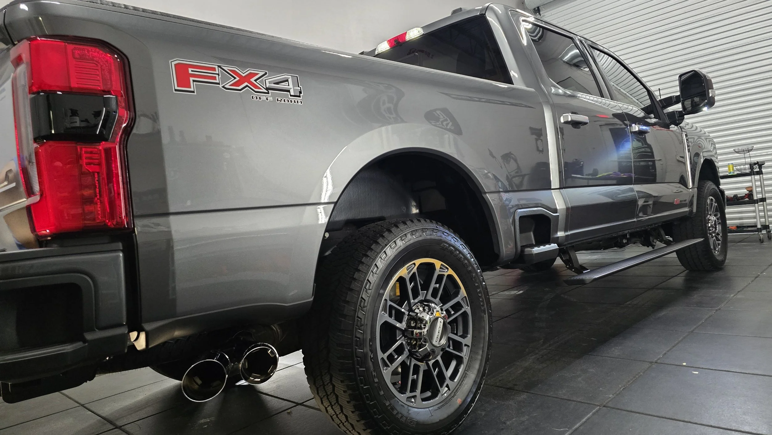 Silver Ford F-250 Super Duty after 7-year ceramic coating inside studio