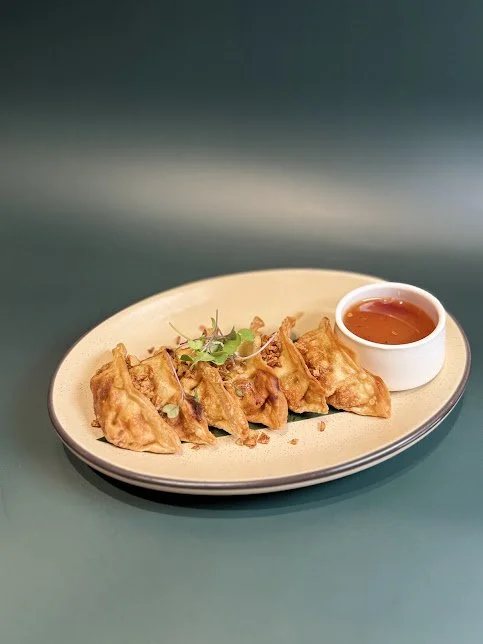Pot Sticker (6)
Deep fried a filling Chinese dumpling, stuffed with ground chicken and vegetables. Served with sweet and sour sauce.