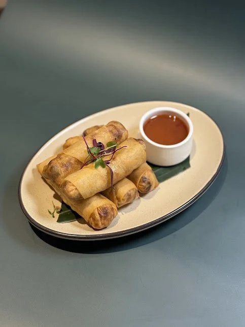 78 Crispy Spring Rolls (5)
Golden fried handmade rolls stuffed with vermicelli, cabbage, carrot served with sweet and sour sauce.
