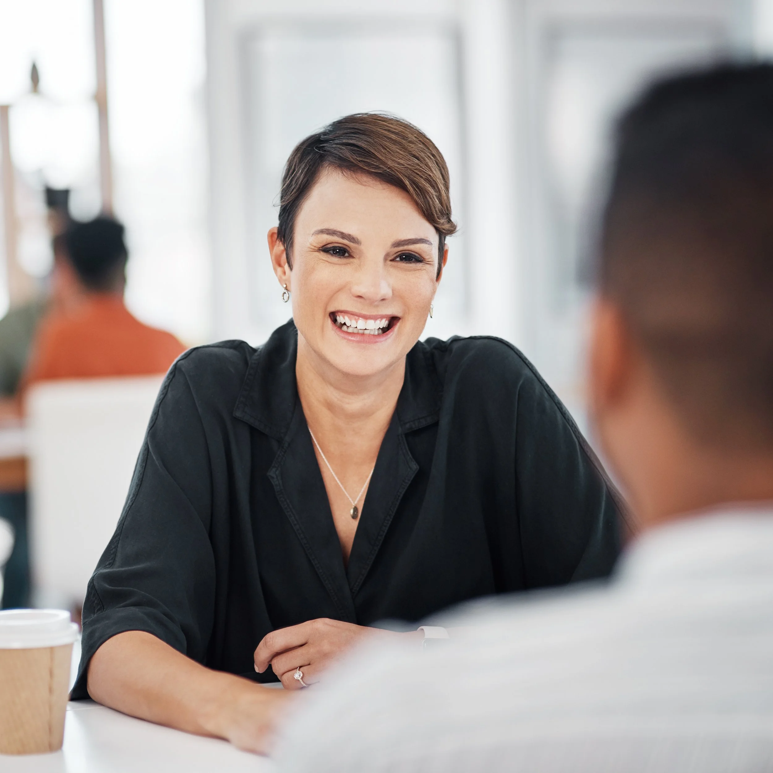 smiling-woman-in-business-meeting-at-office-2026-03-25-02-52-55-utc.jpg