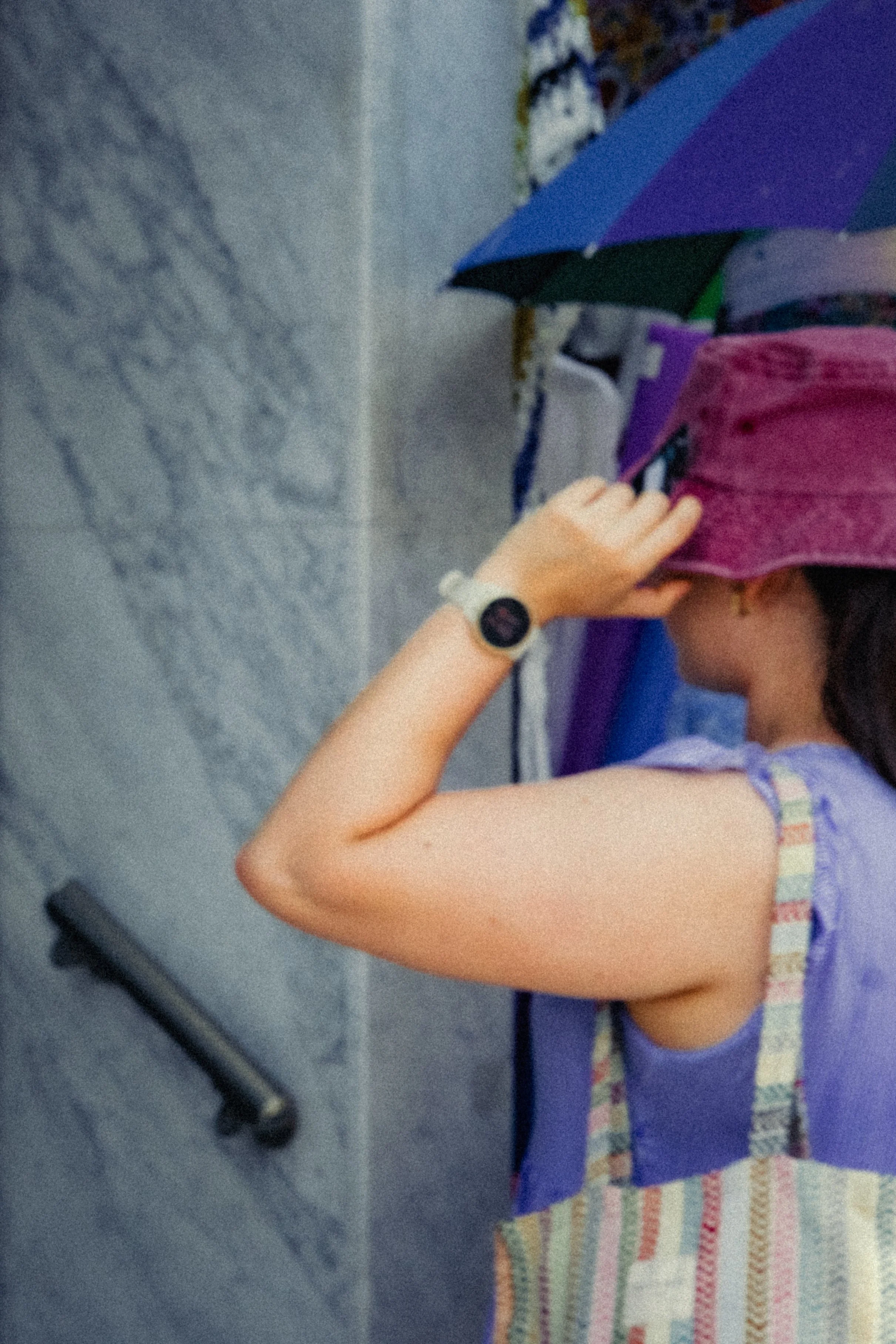 Girl Trying On A Hat.jpeg