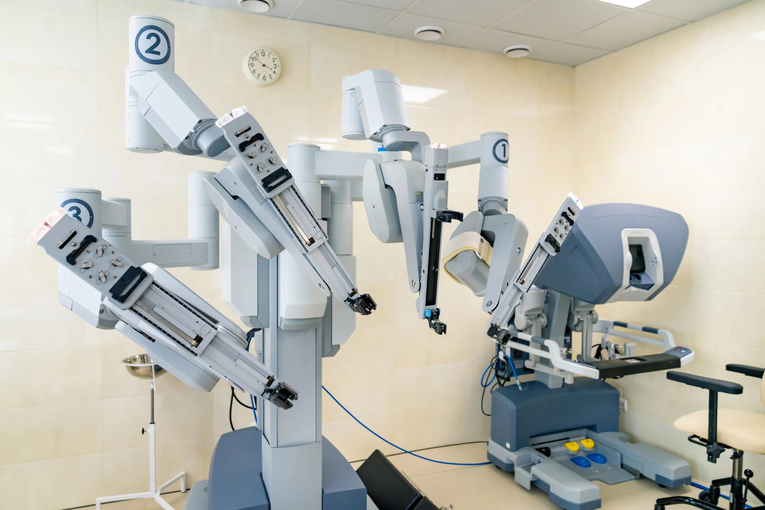Robotic surgical arms in a hospital operating room
