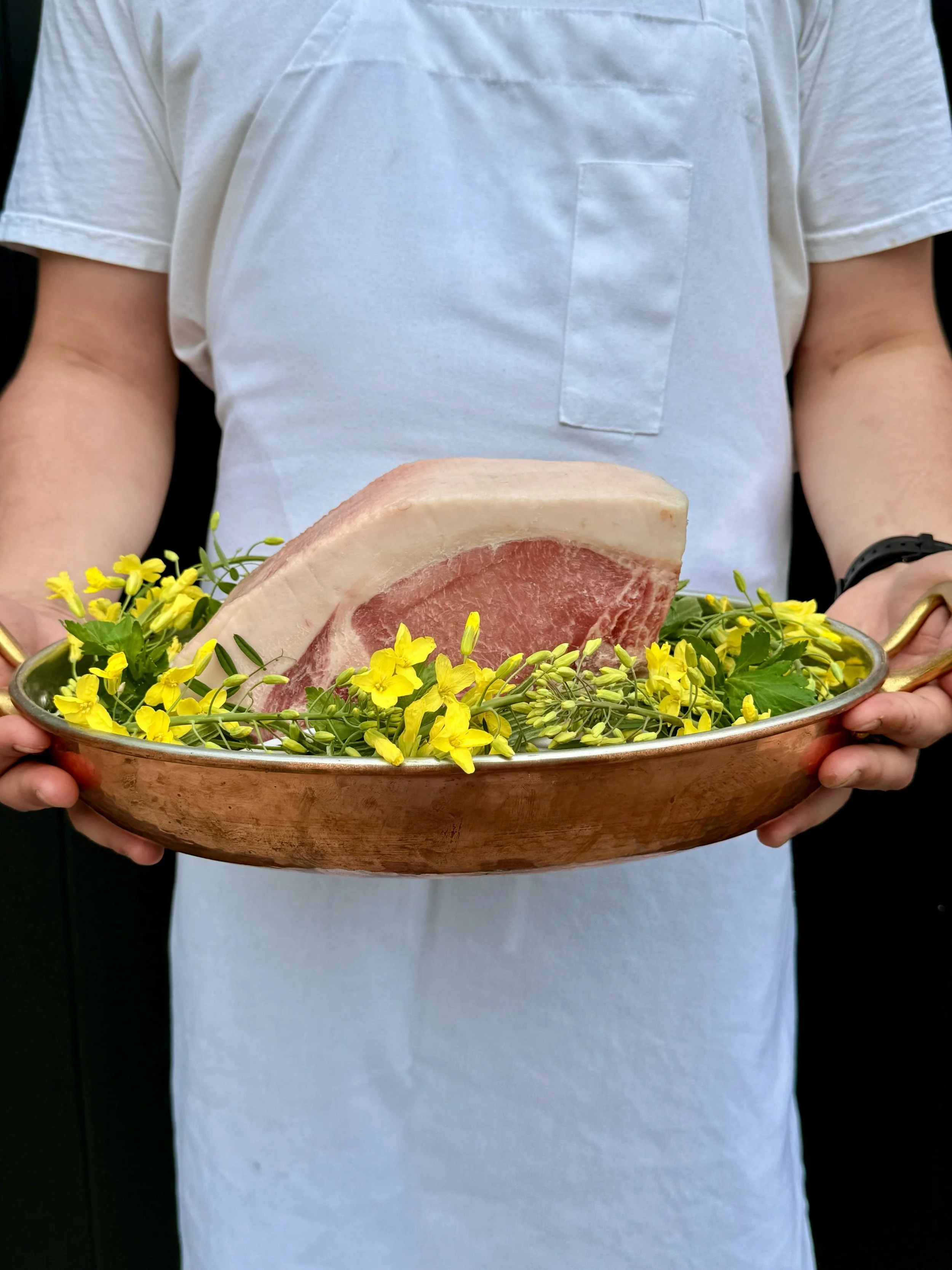Chef presenting premium ingredients at a restaurant near Nissan Stadium in Nashville