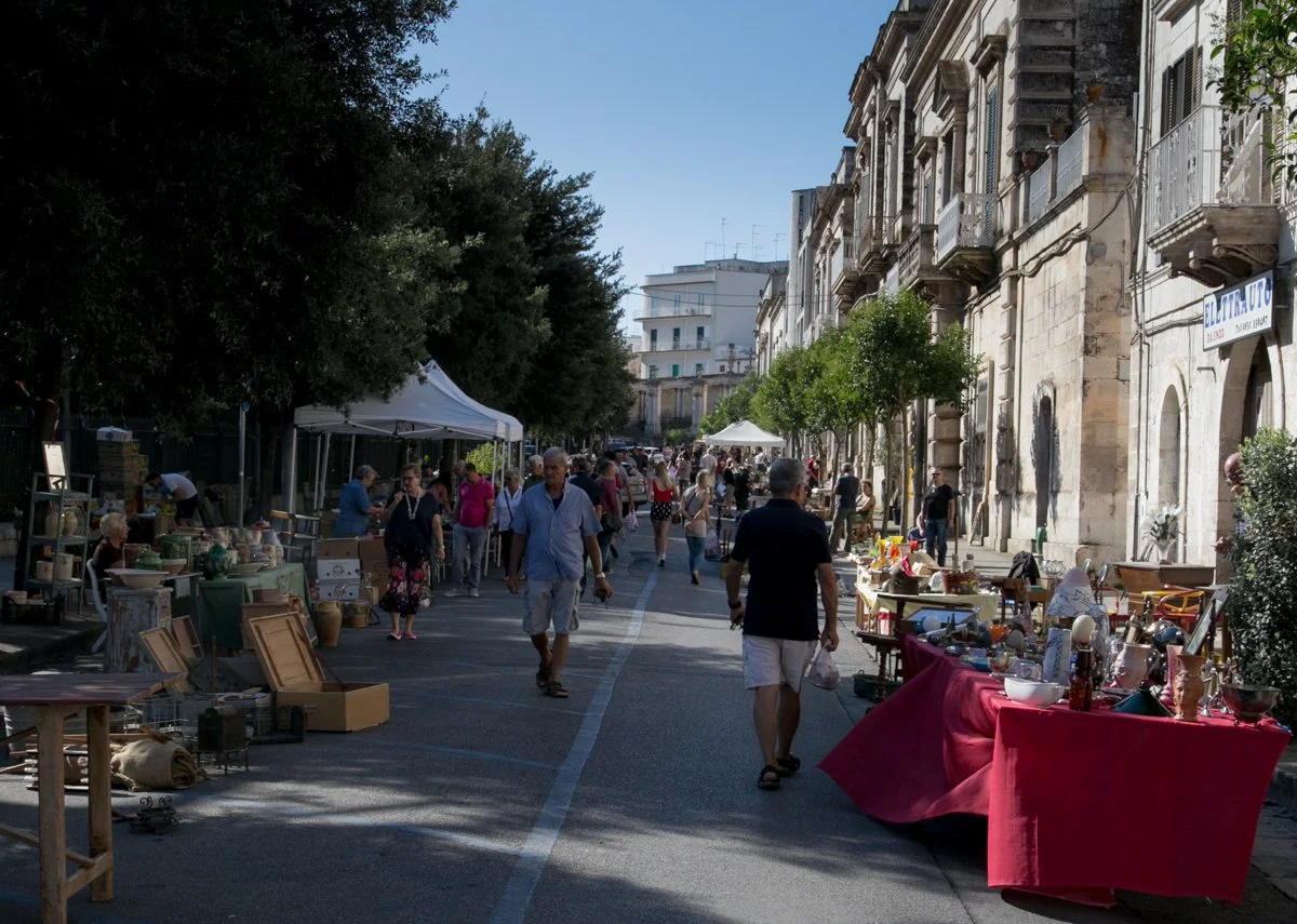 Antiques market stalls along a street in Ostuni