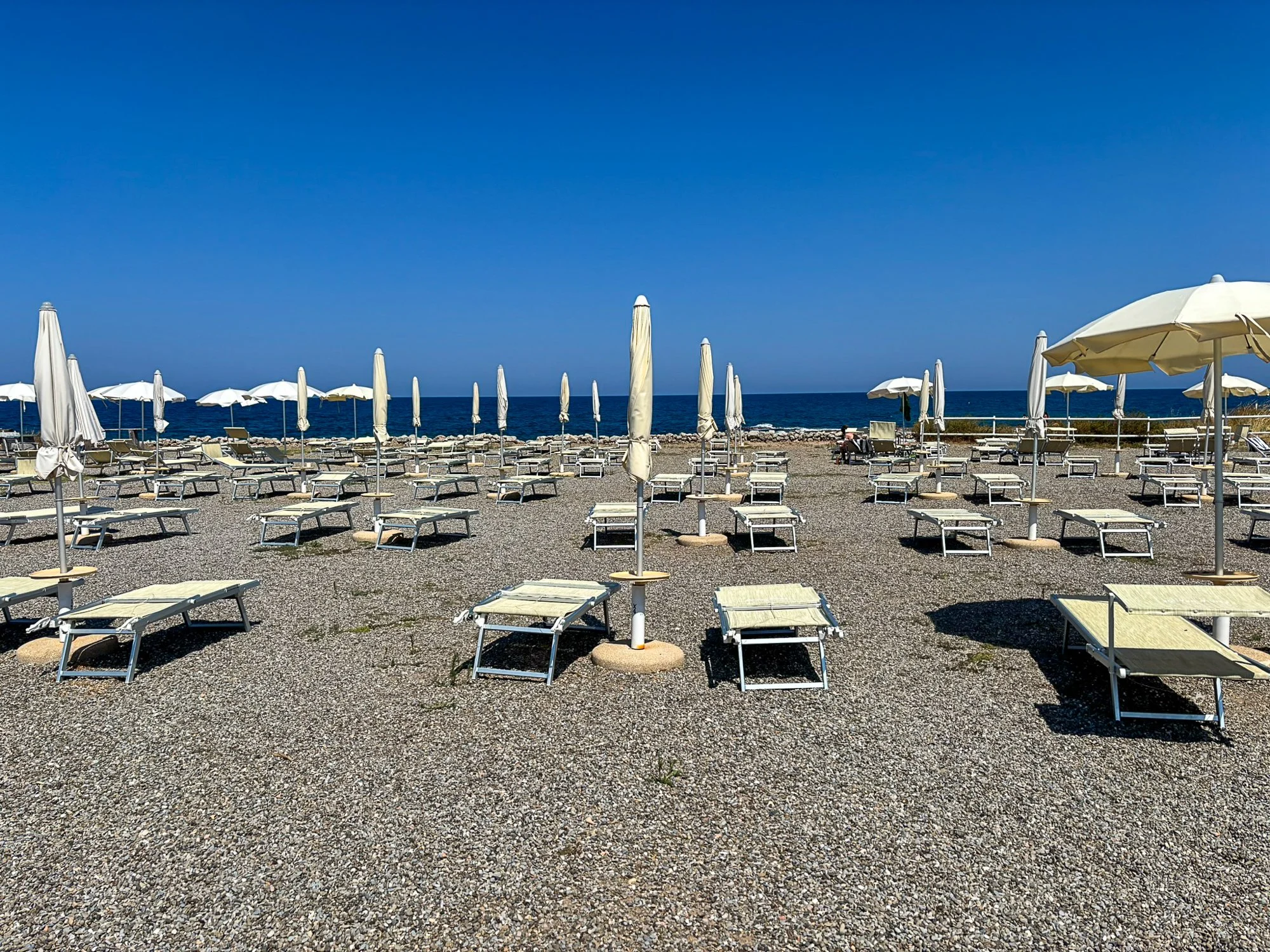 Lido with sunbeds and umbrellas near Savelletri