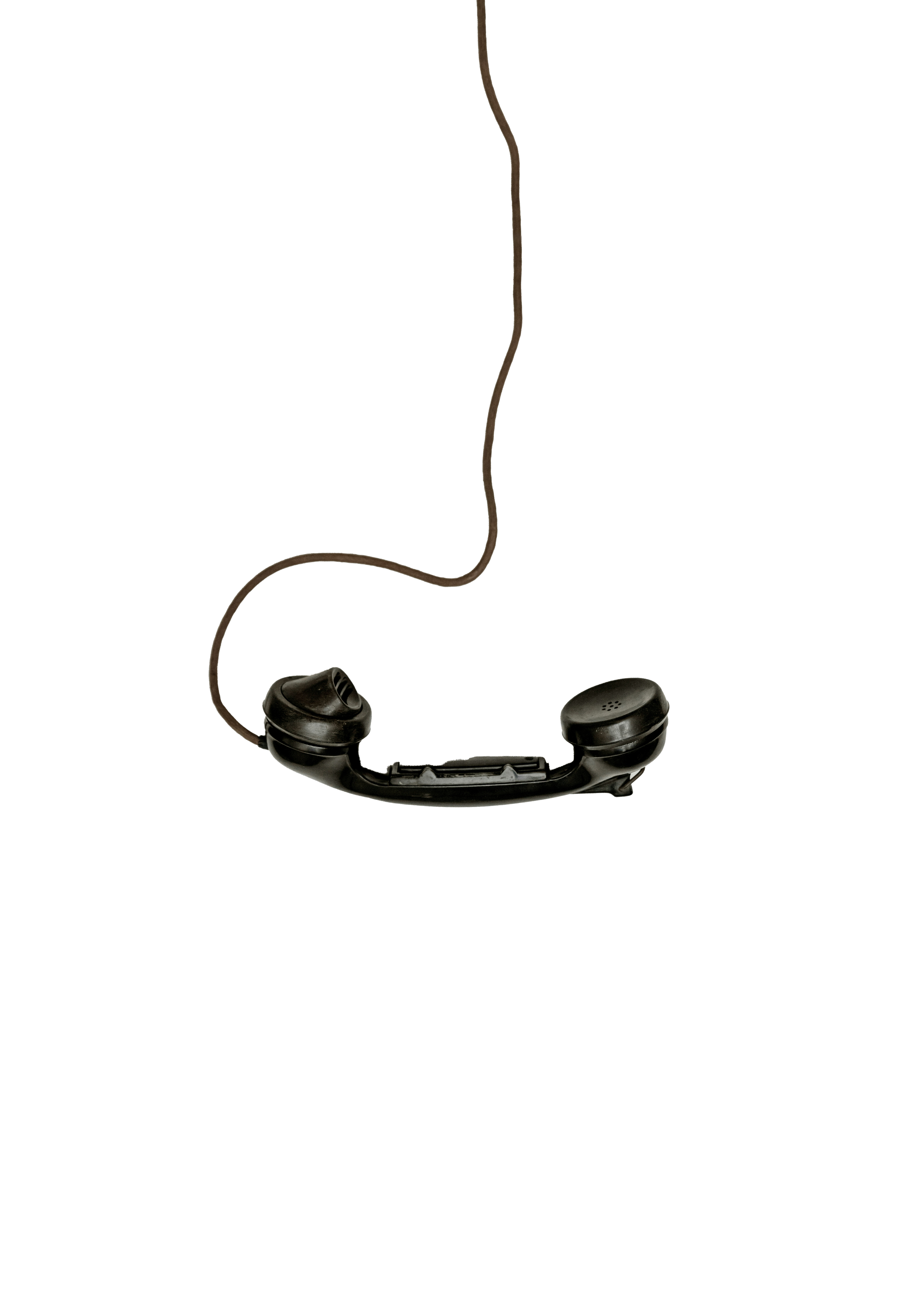 Vintage black telephone on a white background.