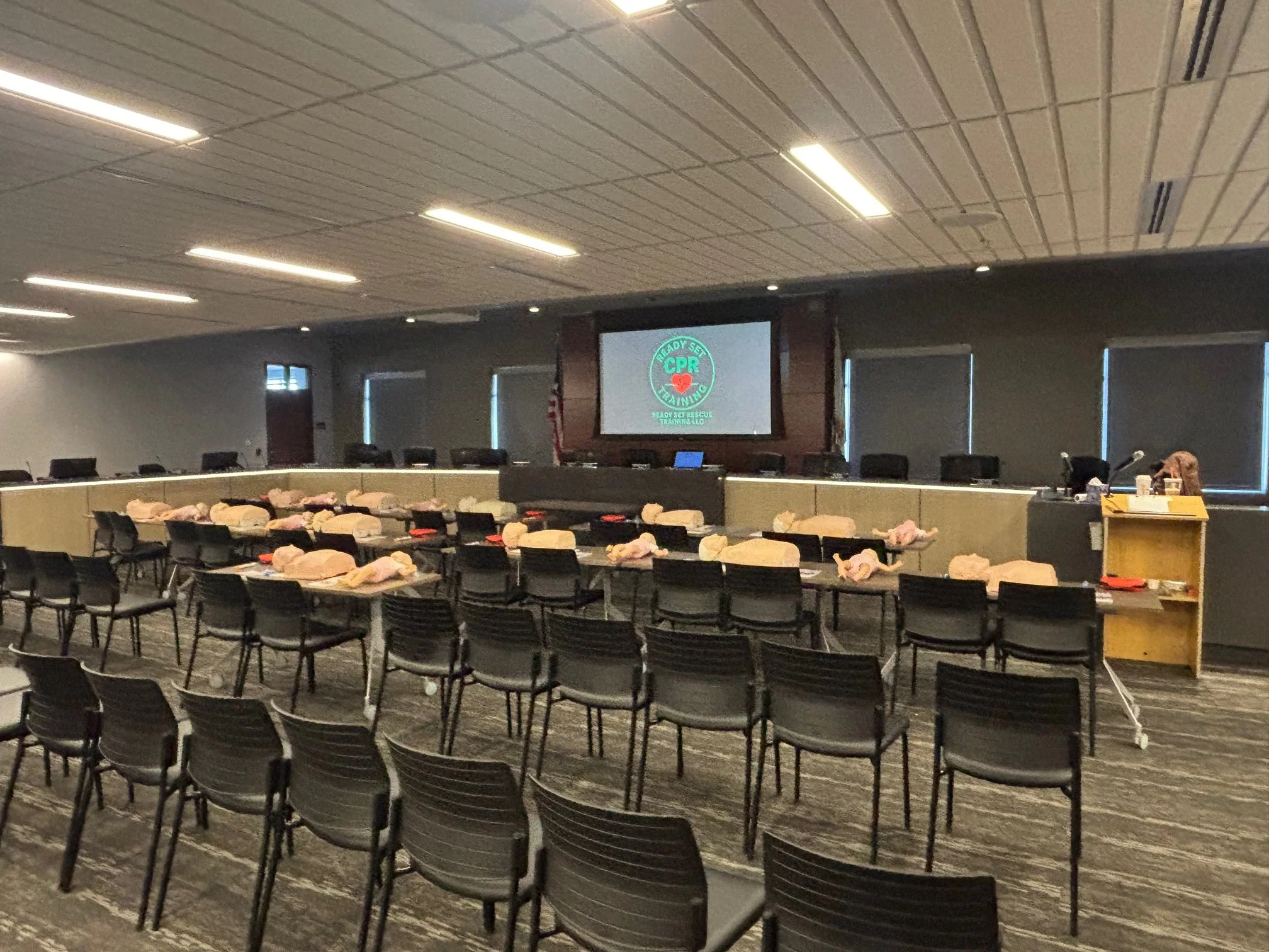 A conference room Manufacturing employees participating in private workplace CPR training provided by Ready Set Rescue Training
