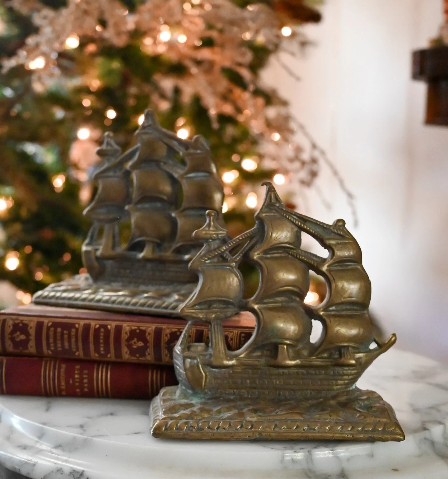 A striking pair of vintage solid brass bookends featuring detailed clipper ships in full sail &mdash; a perfect nod to the beloved carol &ldquo;I Saw Three Ships.&rdquo; Their warm golden tone and gentle patina add timeless nautical charm, making the