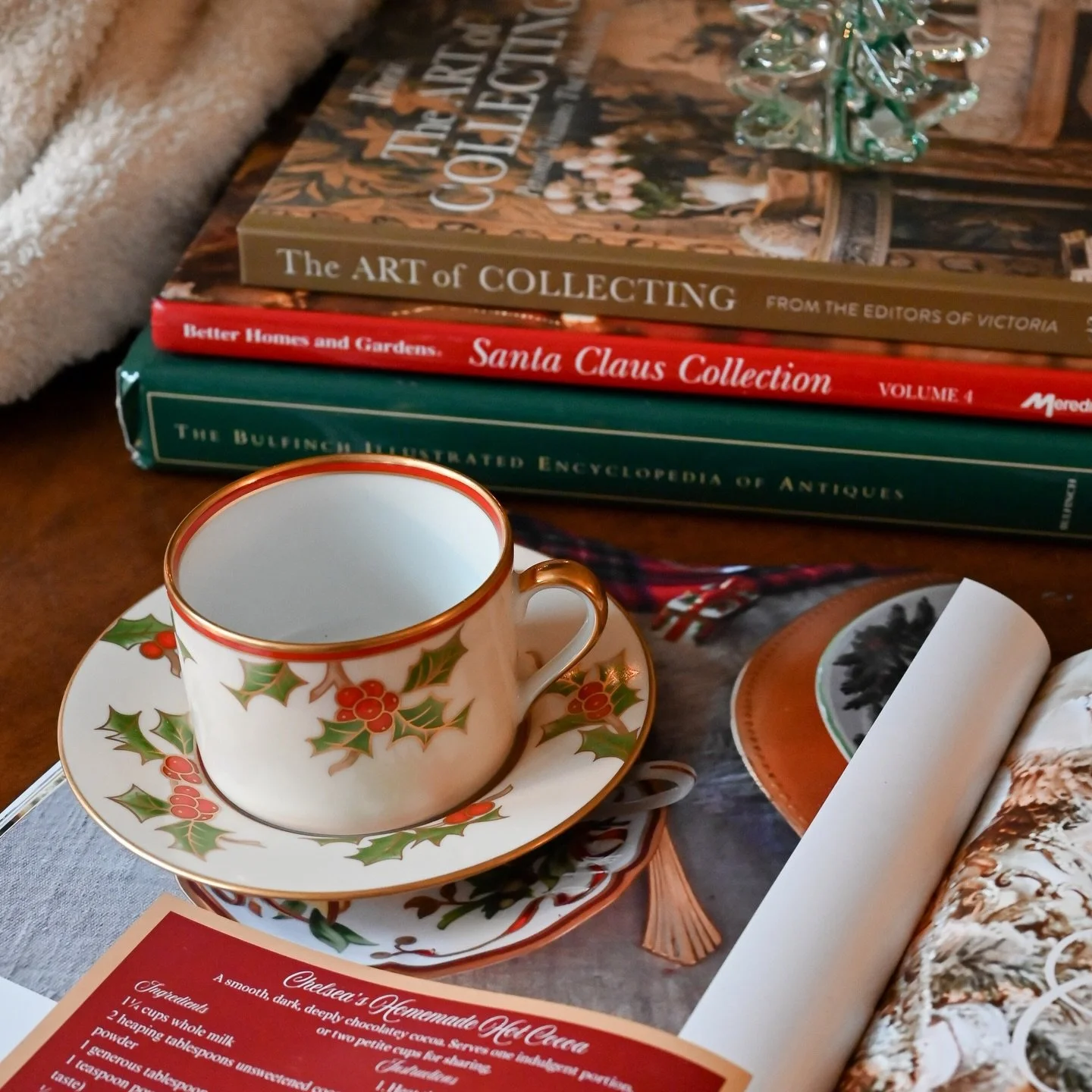 A charming and collectible holiday piece from Fitz &amp; Floyd, this vintage cup and saucer set features the brand&rsquo;s classic Christmas holly motif &mdash; vibrant green leaves, bright red berries, and elegant gold detailing along the rim and ha
