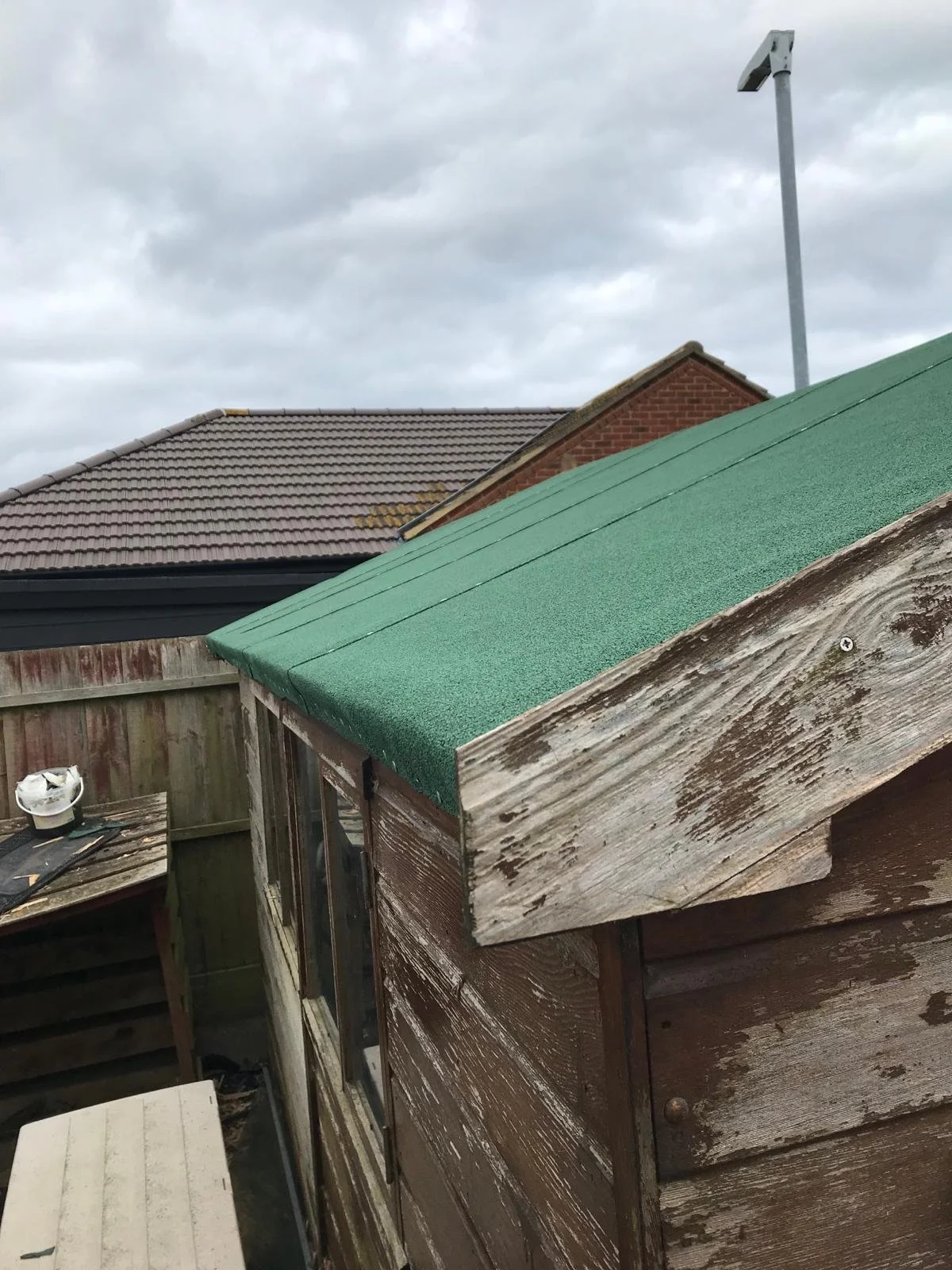 Replacing old leaking shed roof with a new Shed roof.