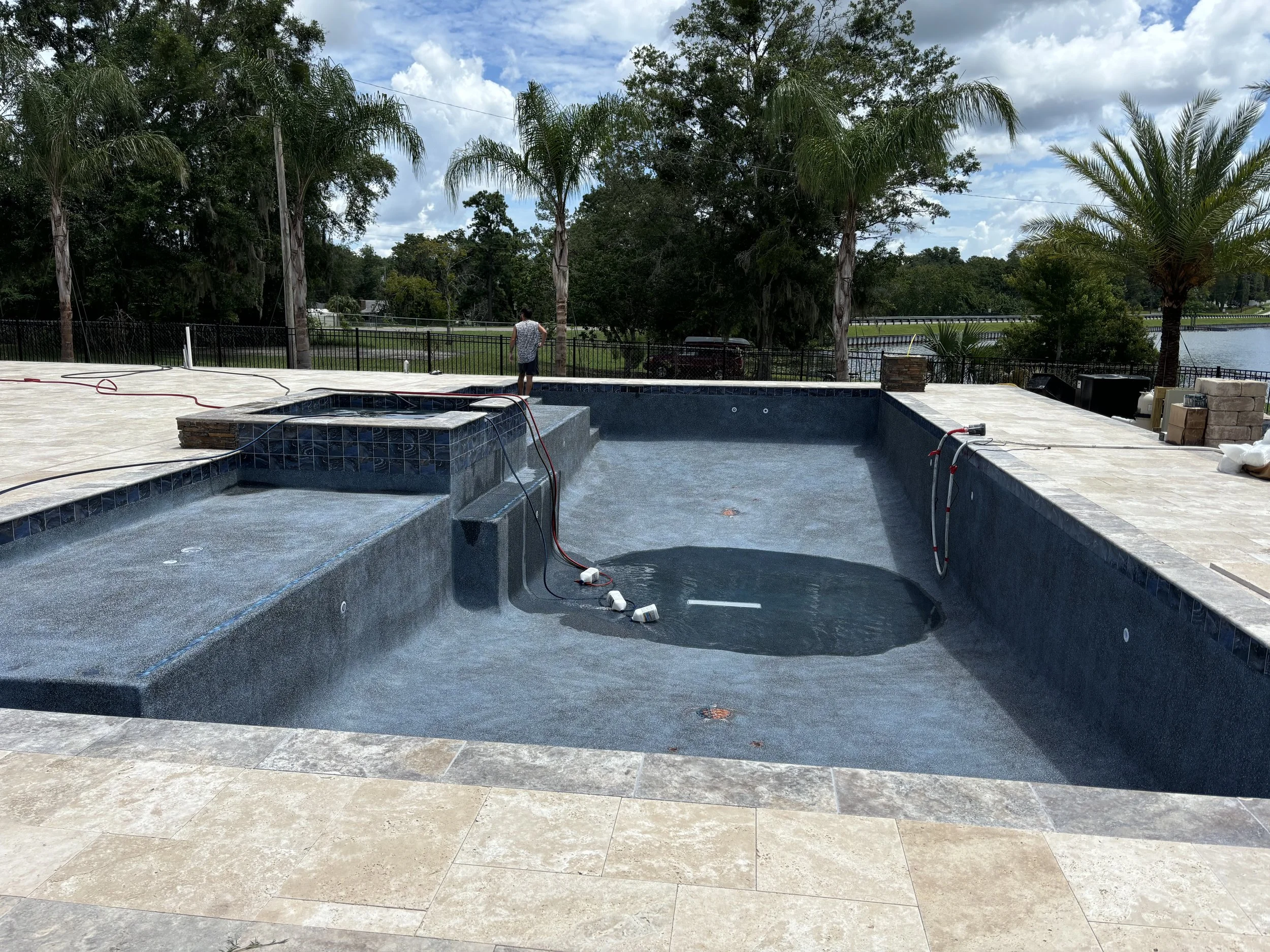 Custom Pool and Spa Builders in St. Johns county, Flagler county, Clay County, and Duval County with maintenance, water features, pavers, and patios.