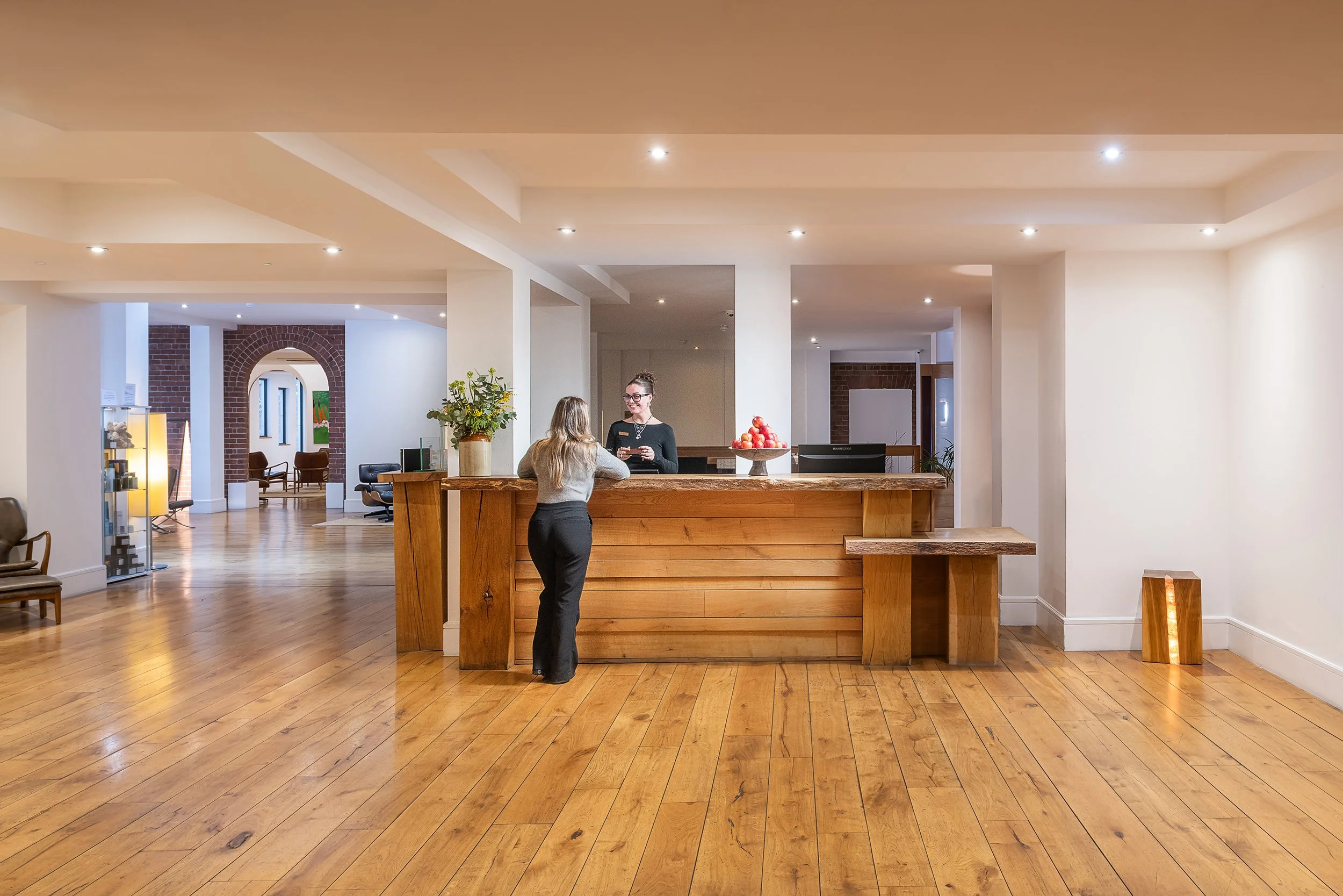 Reception area and wooden desk at Hope Street Hotel captured by UK commercial architectural photographer Si Ranshaw.