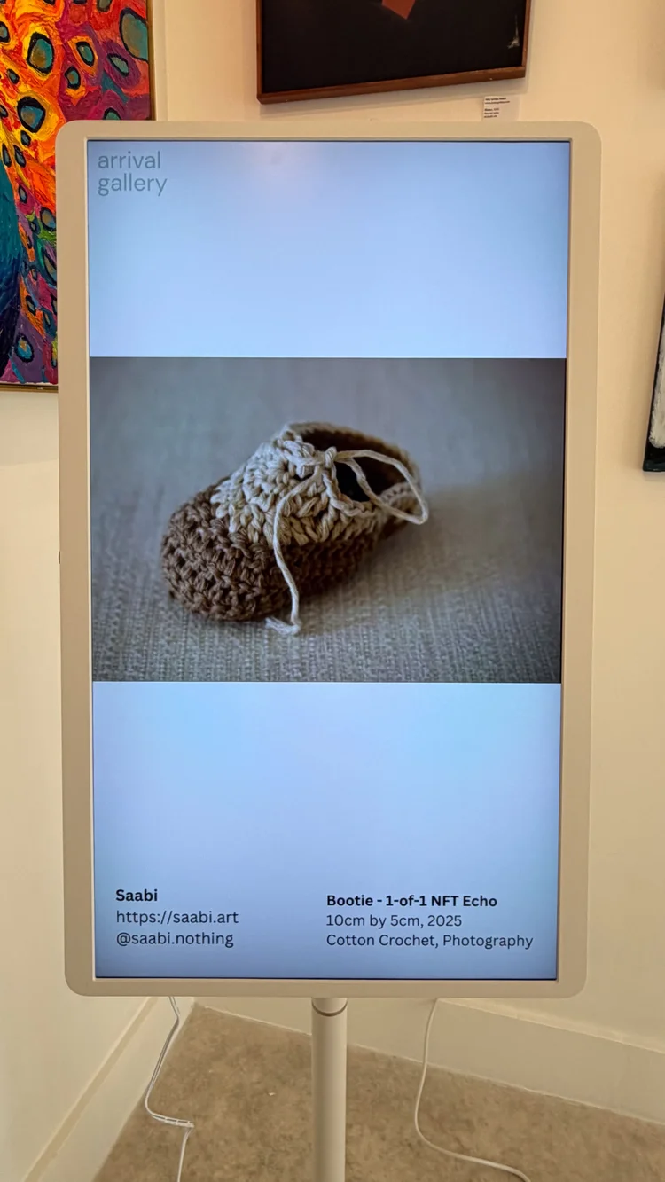 Arrival Gallery photography showcase on digital screen