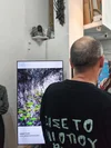 Arrival Gallery photography showcase on digital screen