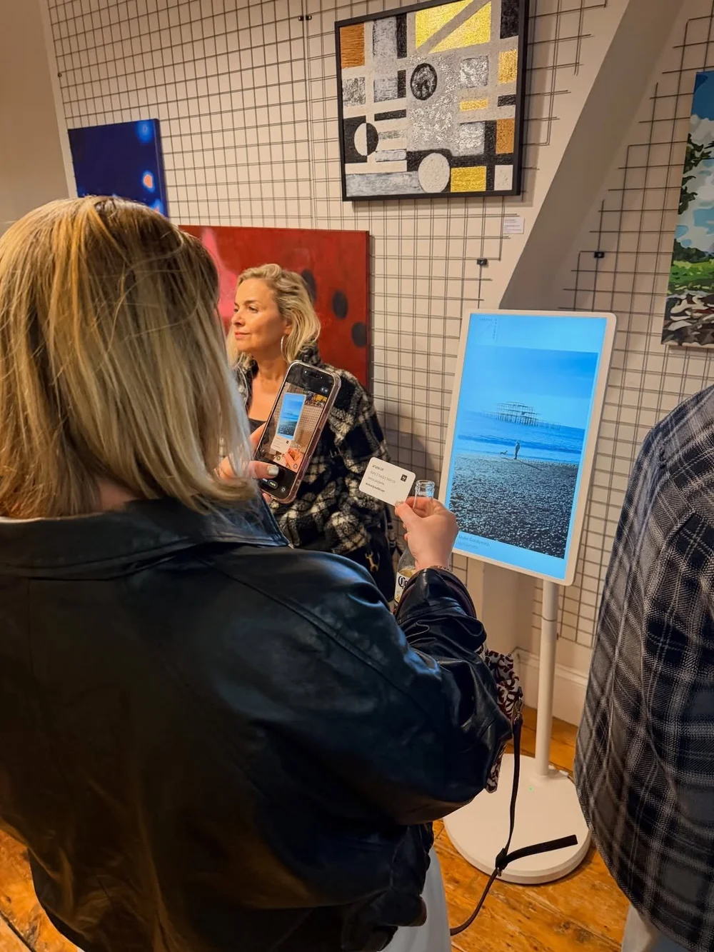 Arrival Gallery Brighton photography showcase on digital screen