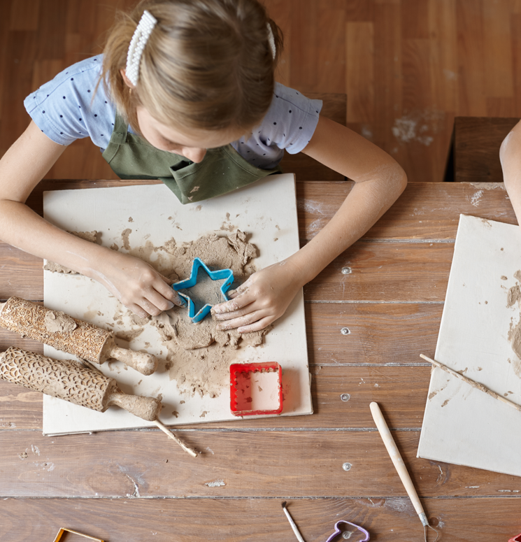 Child playing with arts and crafts at Blossoms Childcare