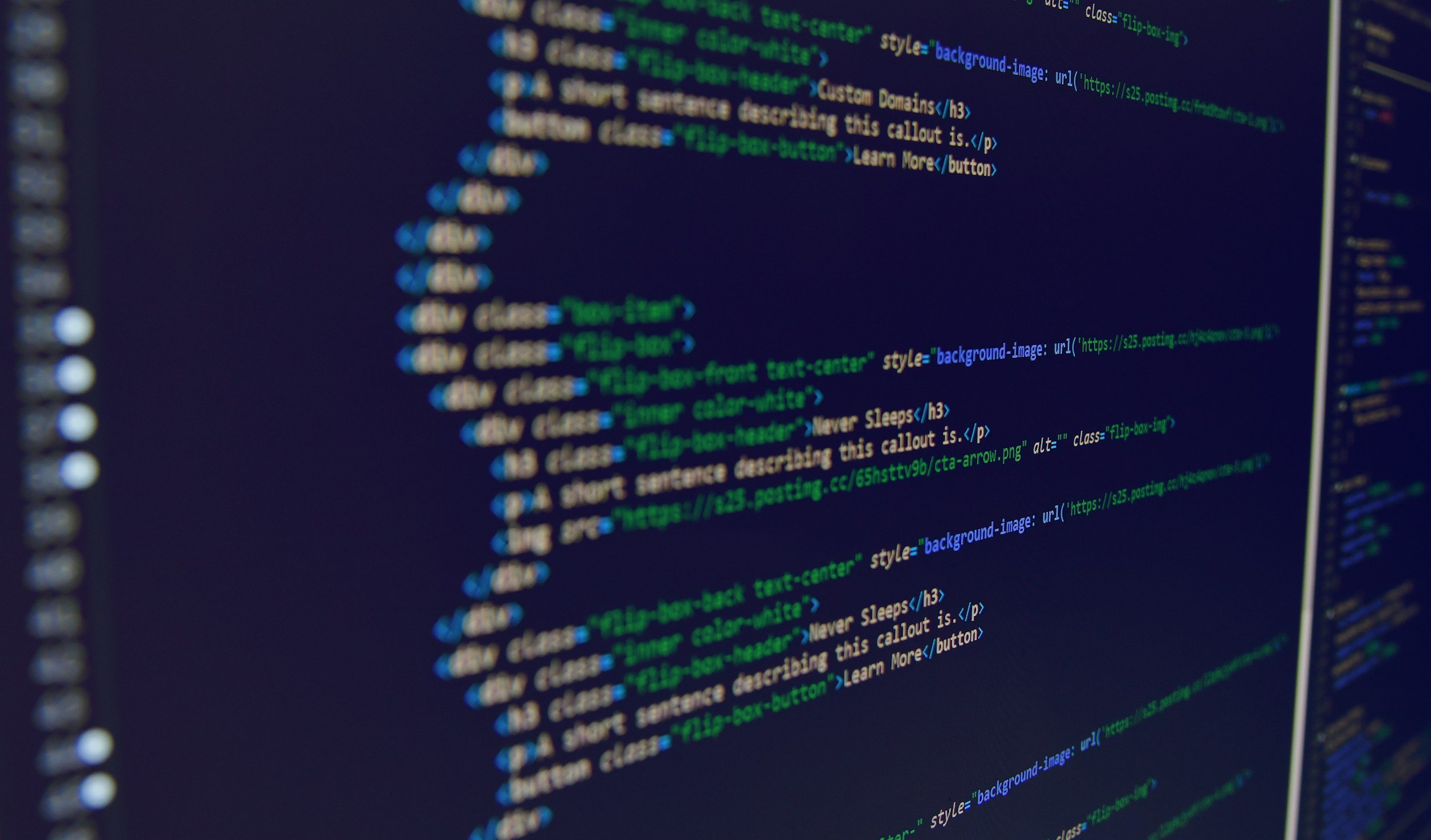 A computer screen displaying code in a text editor, with syntax highlighted in colors such as green, blue, and purple.