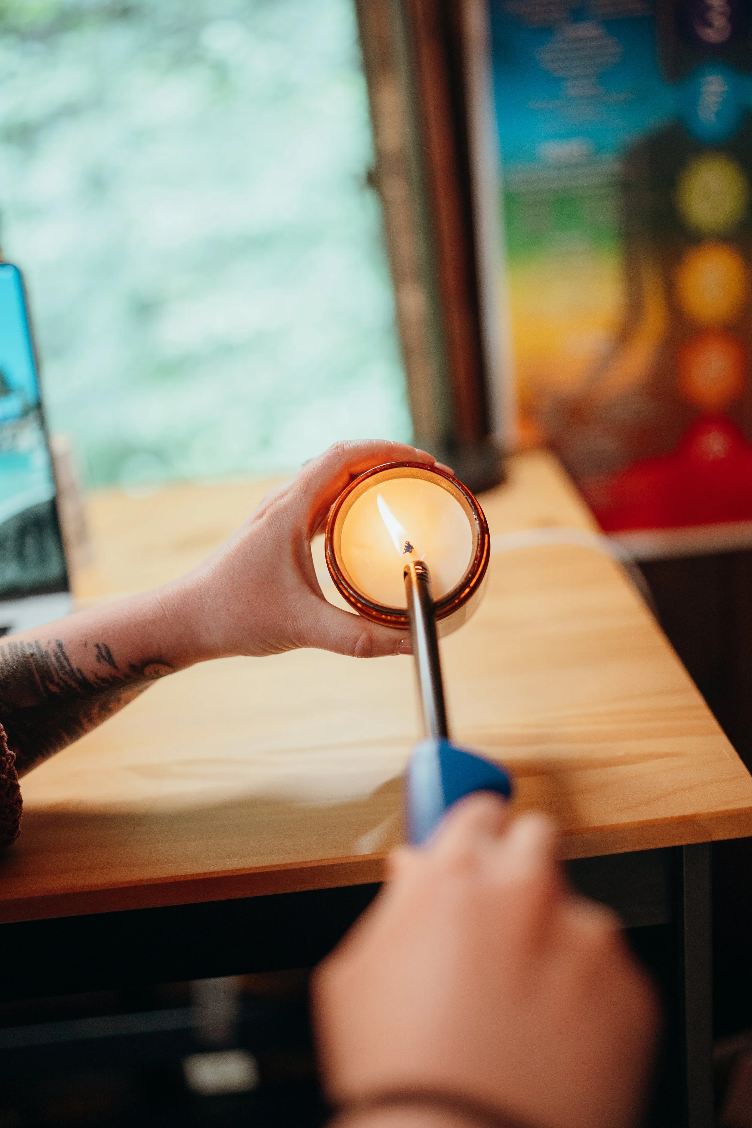 Lighting a candle prior to a SoulBody Wellness Healing Circle.