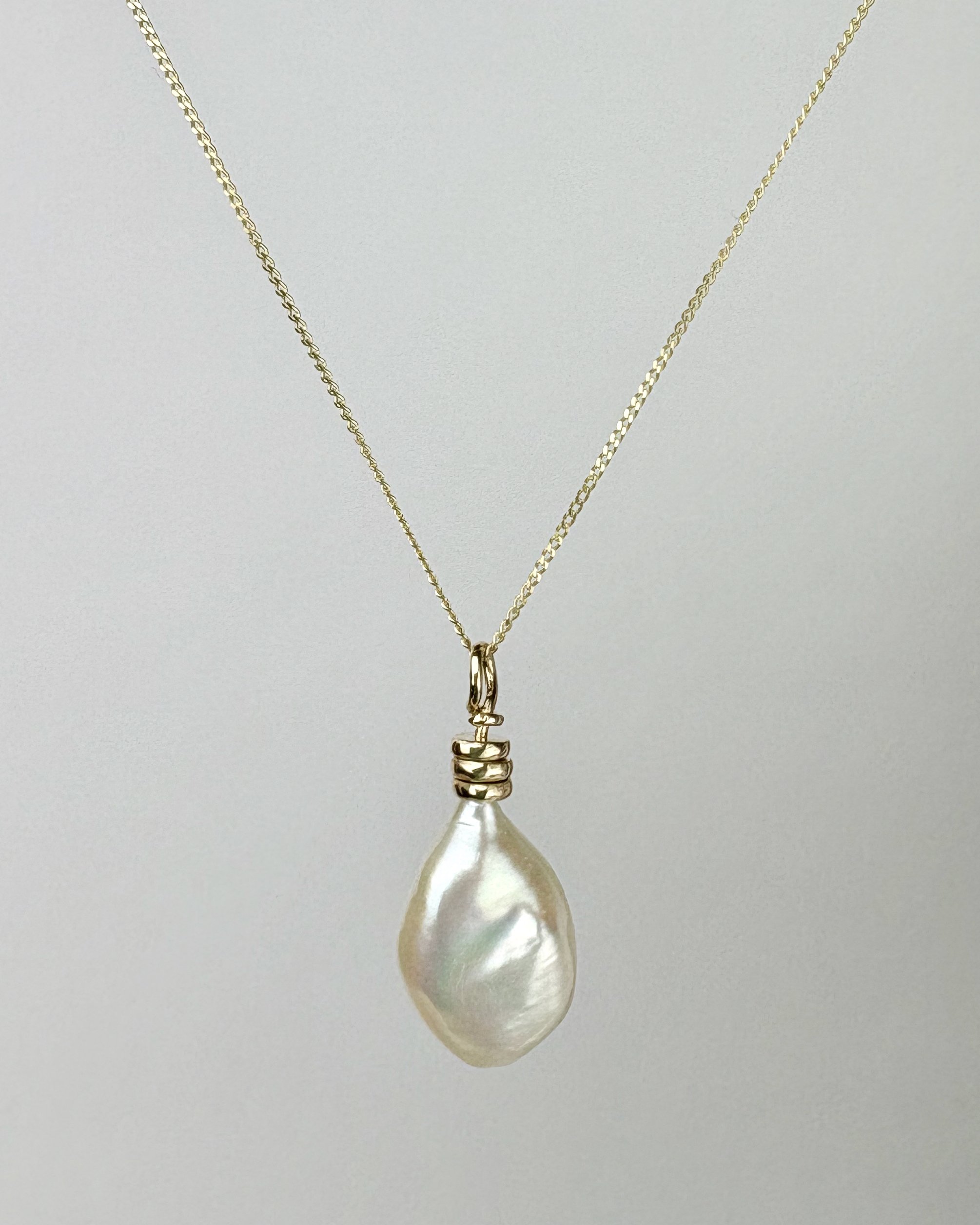 Vessel shaped keshi pearl on 9ct gold Abacus pendant.jpg