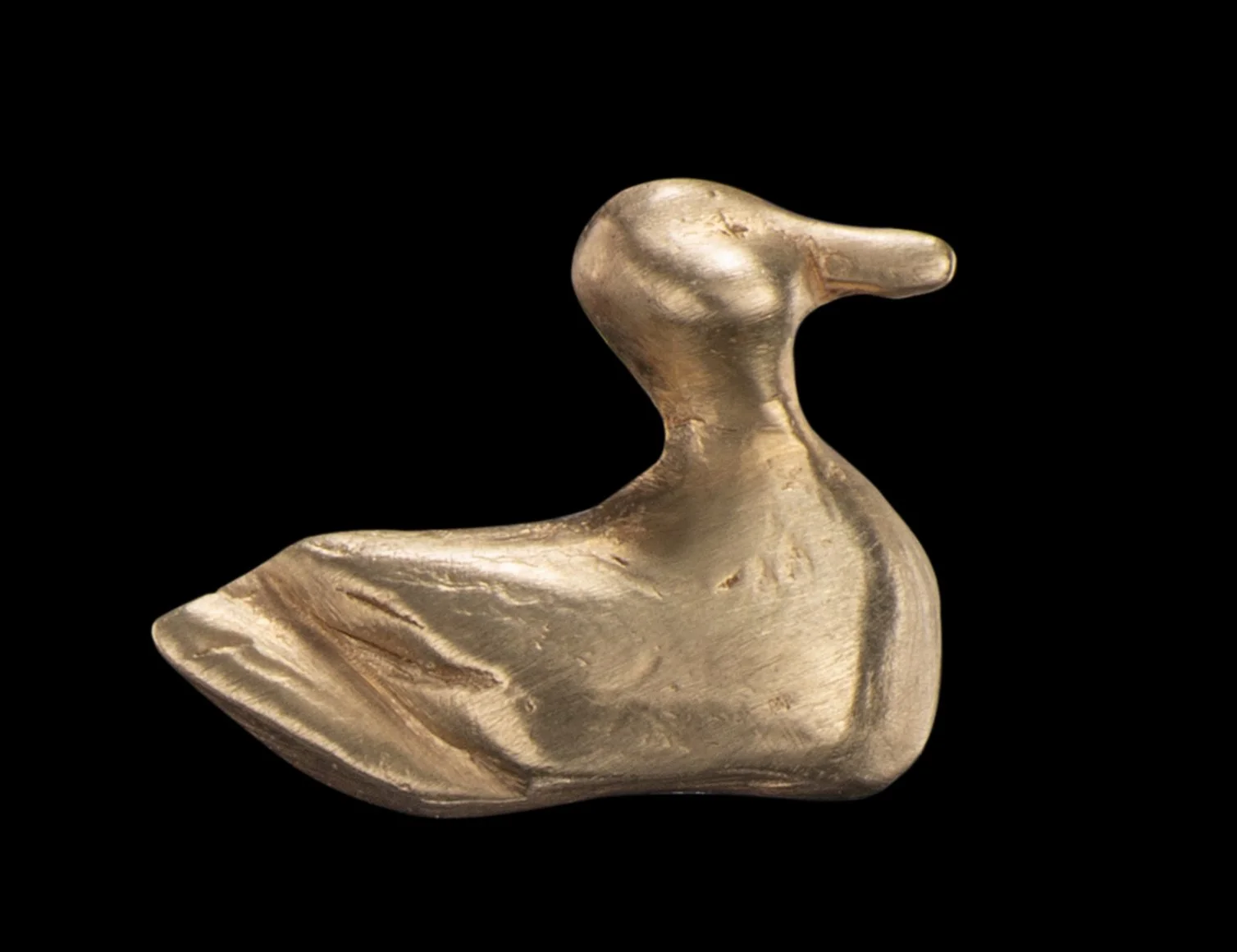 A gold stud earring in the shape of a duck by Alexandra Cordon jewellery