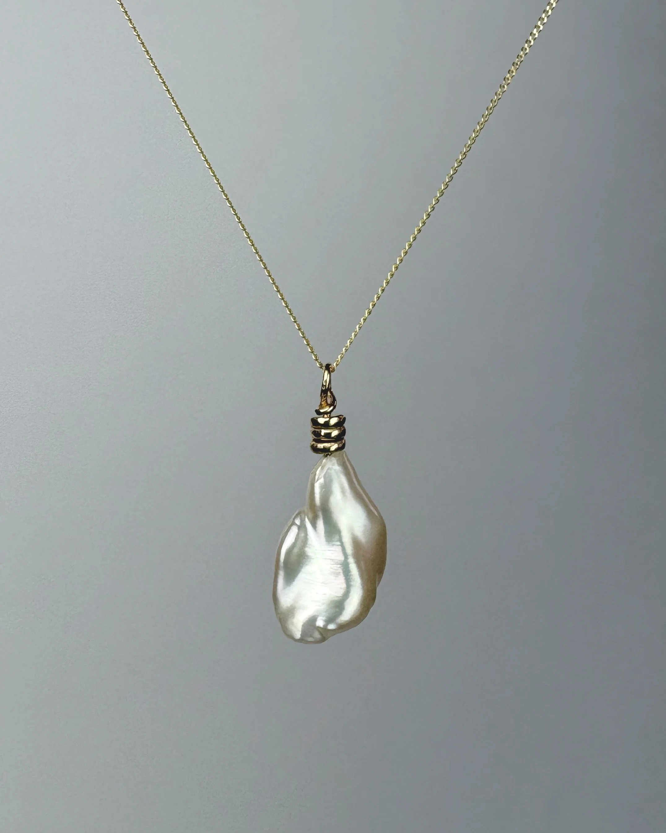 Billowing white keshi pearl on 9ct gold Abacus pendant.jpg
