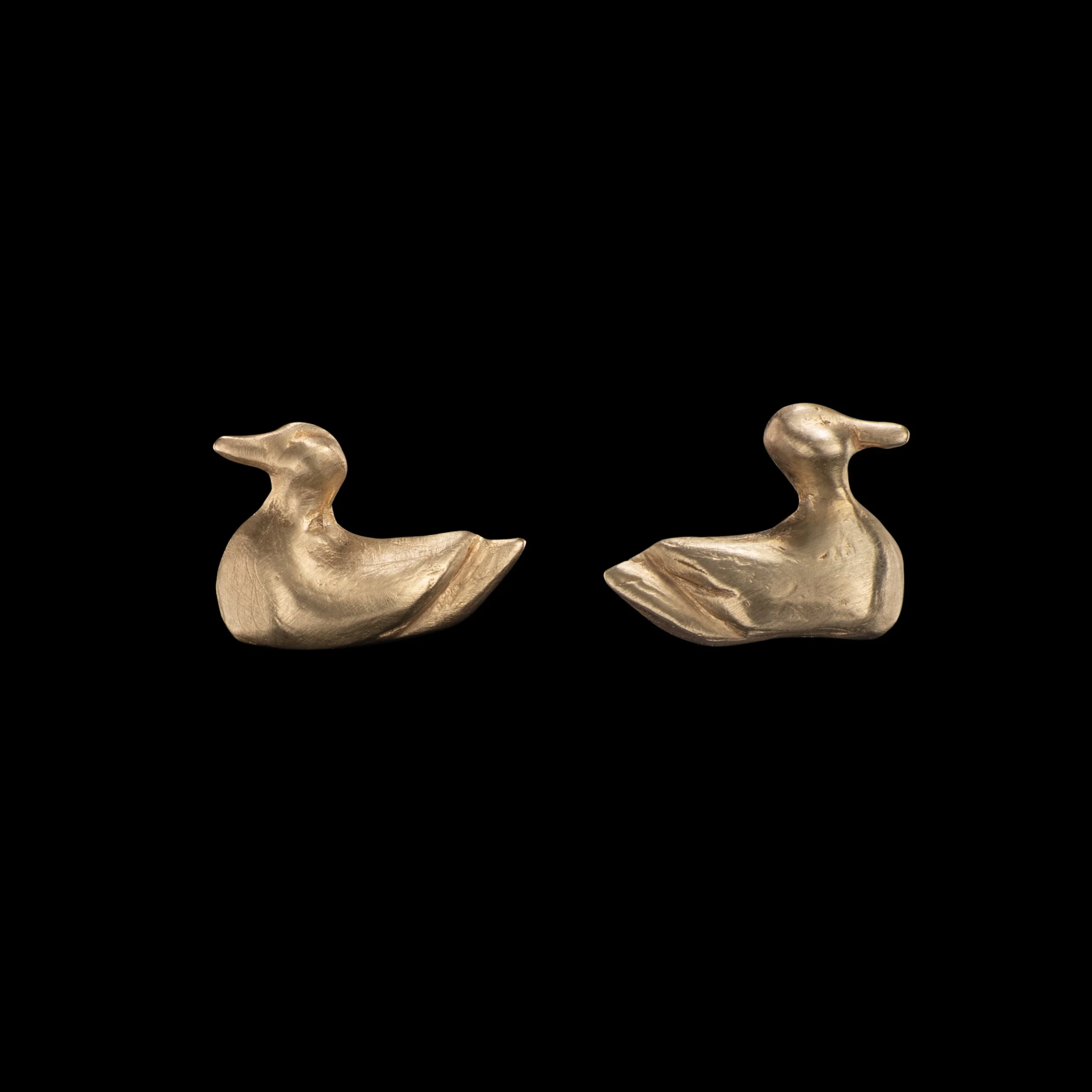 Gold stud earrings in the shape of ducks by Alexandra Cordon jewellery