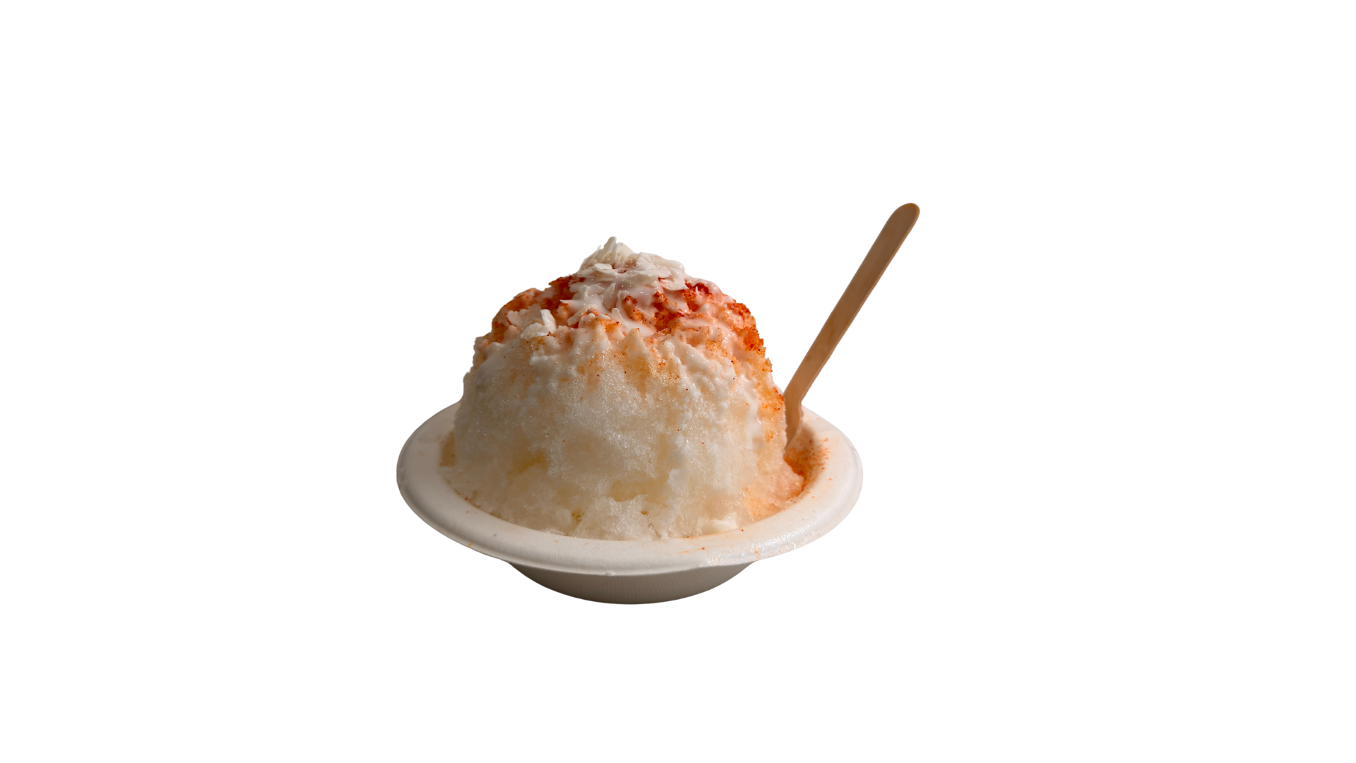 A bowl of shaved ice topped with white cream and red syrup with a spoon