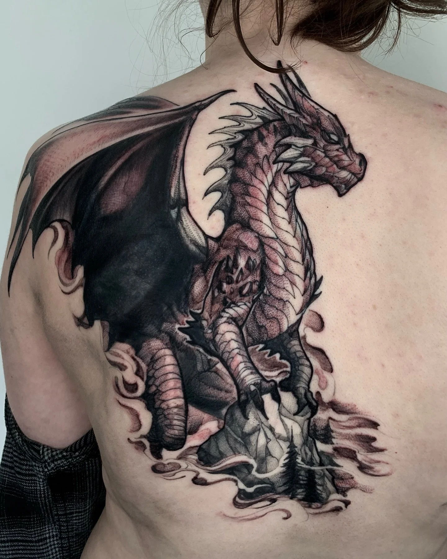 Big Dragon cover up on the back. Some healed and some fresh! Lots of color and heavy-black being covered here, so my solution was heavy-black and pulling the eye towards a different area of the body. Thanks Hannah for making the long trip out here, a