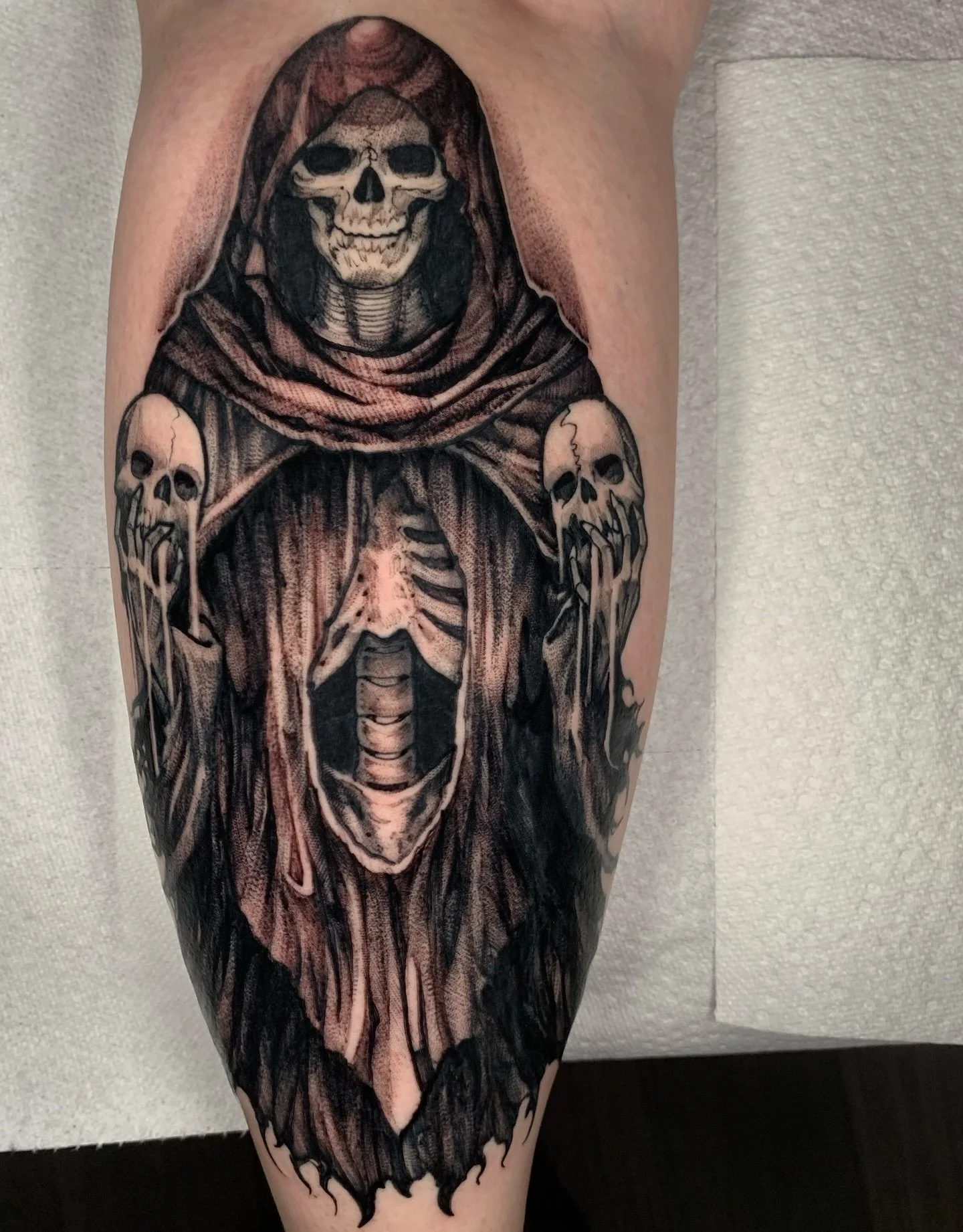 Skeleton Witch on the back of the calf, some healed, some fresh. This one is based off the artwork for the Metallica M72 tour! Thanks for trusting me with such a fun piece Madison!