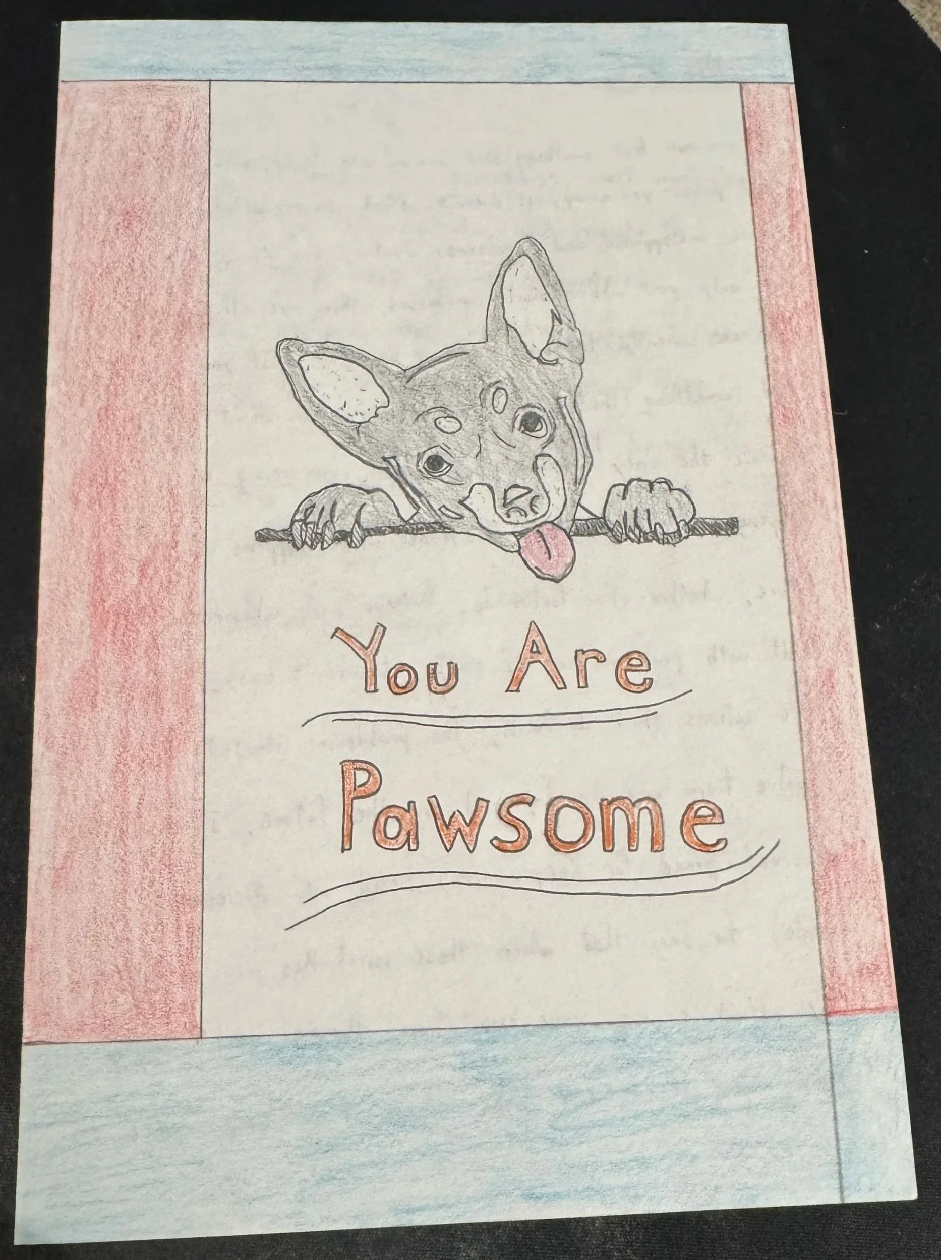 A hand-drawn card with a sketch of a playful dog with a long tongue, peeking over a line. The card has the words "You Are Pawsome" written in colorful letters.