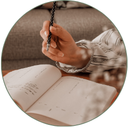 Person writing in notebook