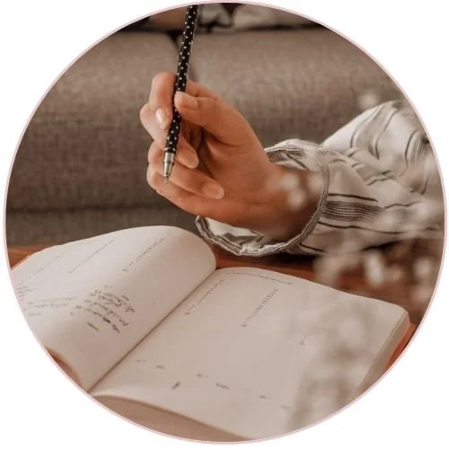 Person writing in a notebook